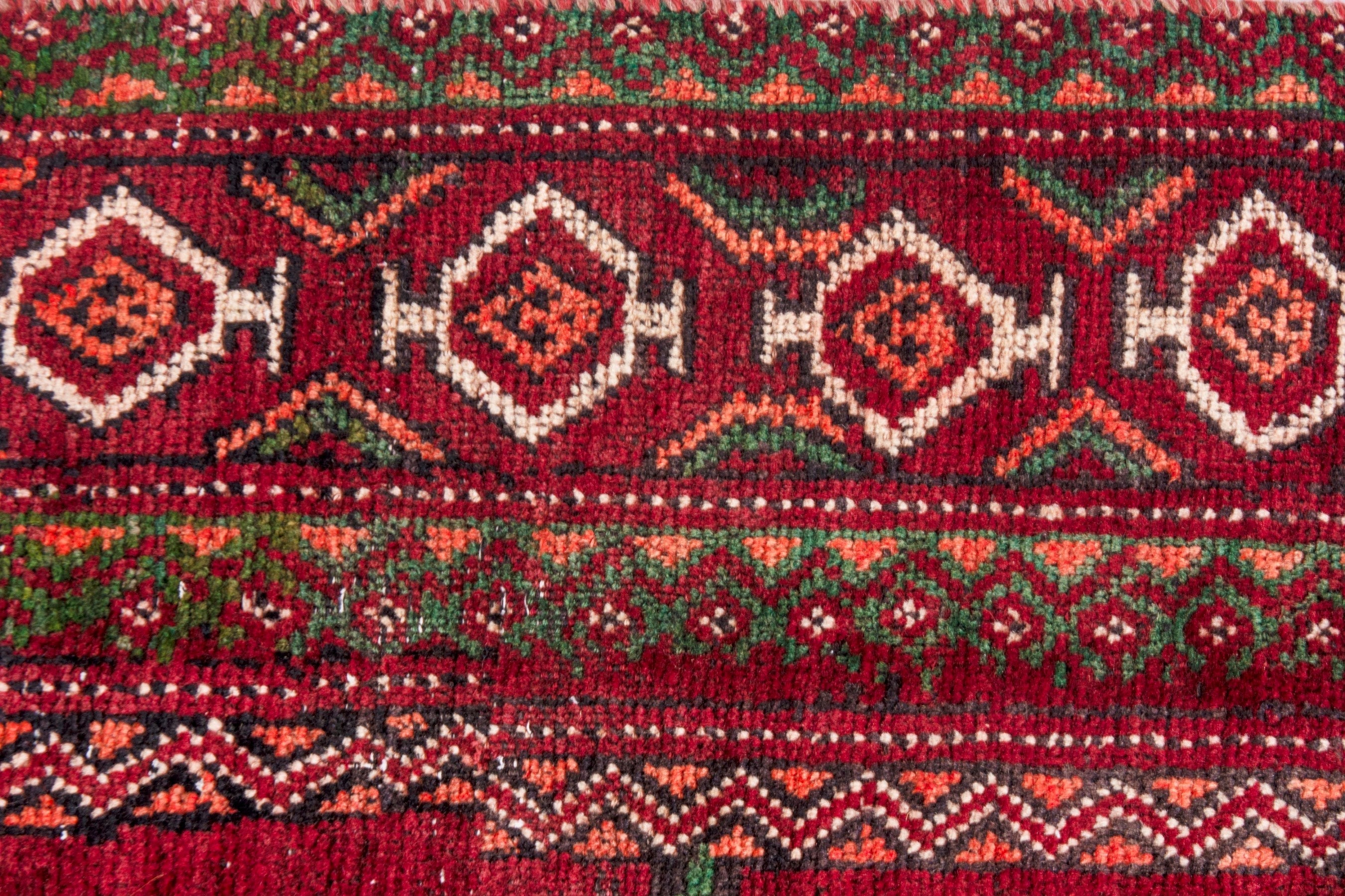 Persian Torkaman runner rug in deep red and faded red, view 12 of 22