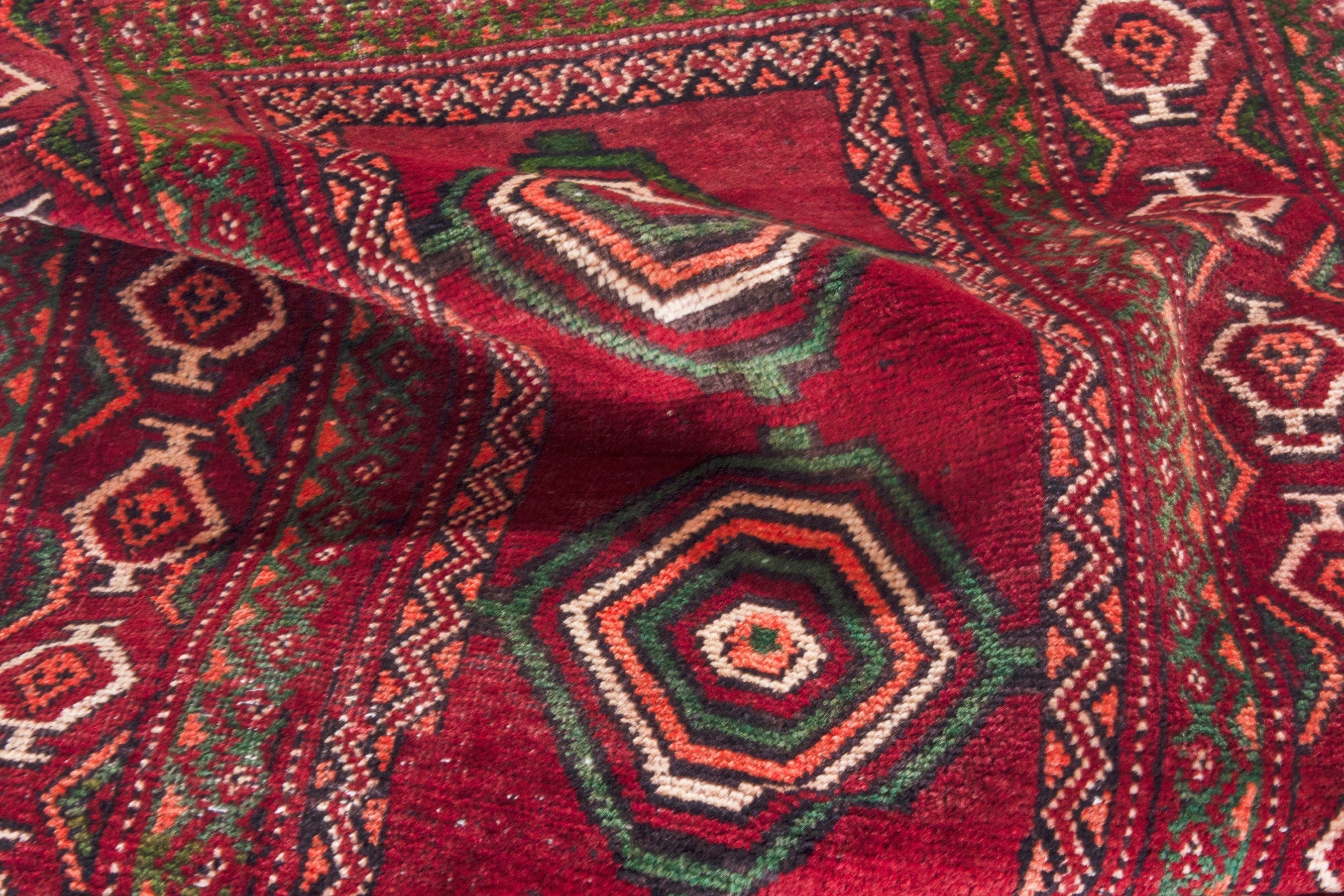 Persian Torkaman runner rug in deep red and faded red, view 19 of 22