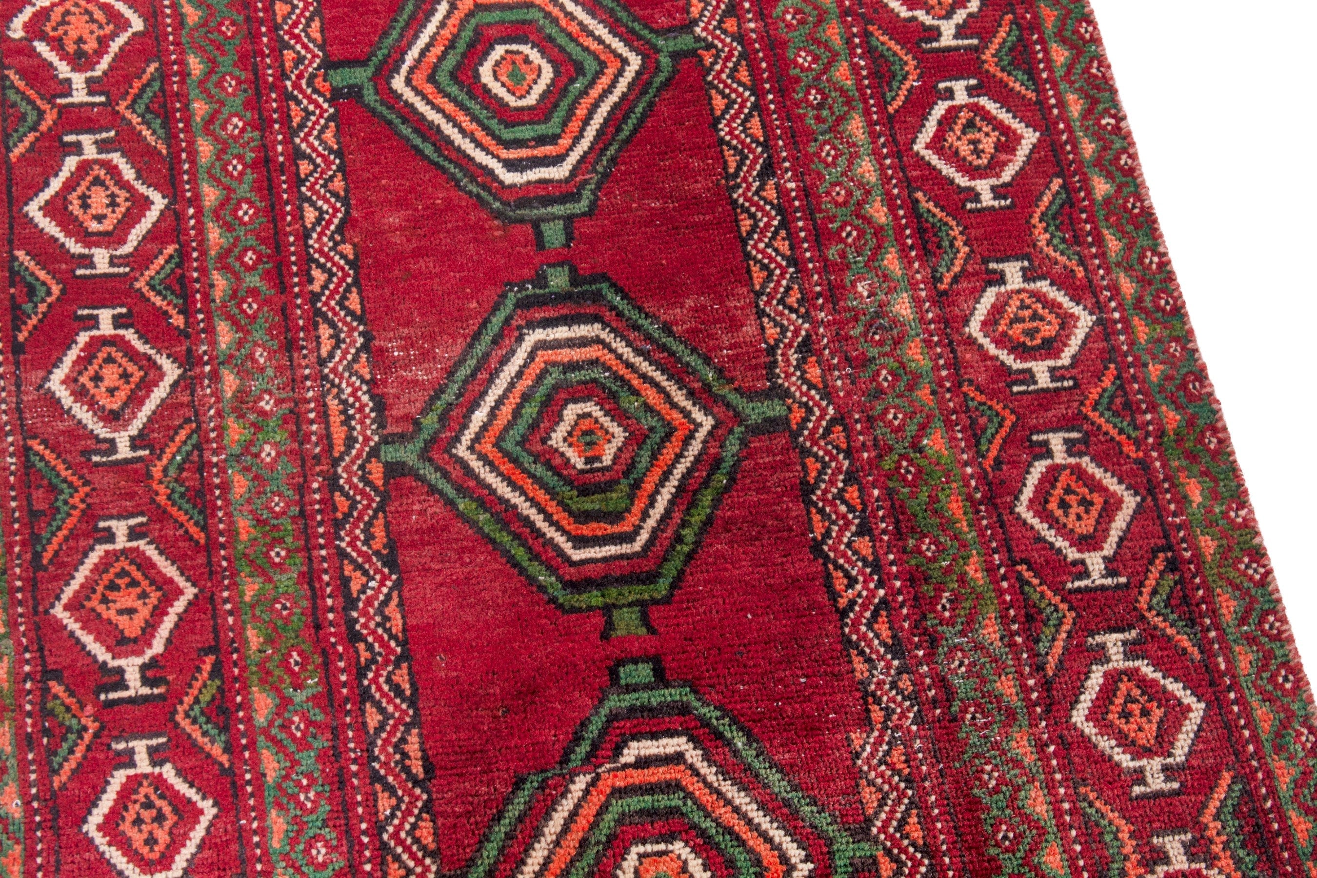 Persian Torkaman runner rug in deep red and faded red, view 10 of 22