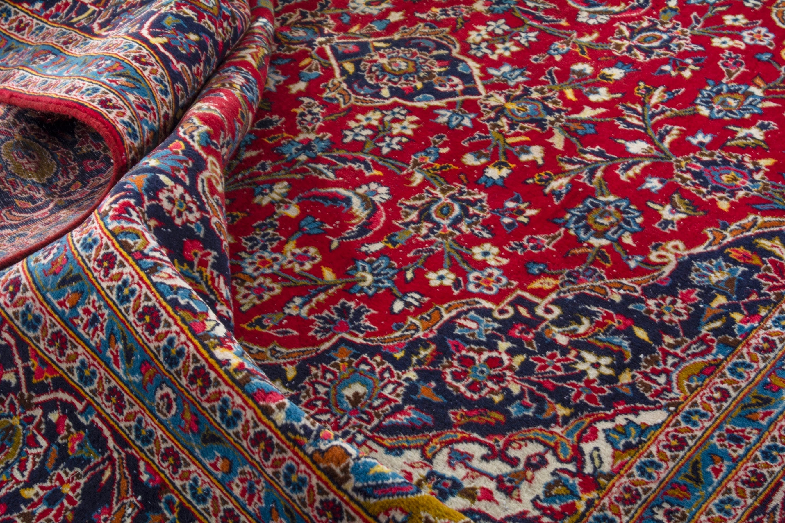 Persian Kashan oversized rug in deep red and navy, view 17 of 20