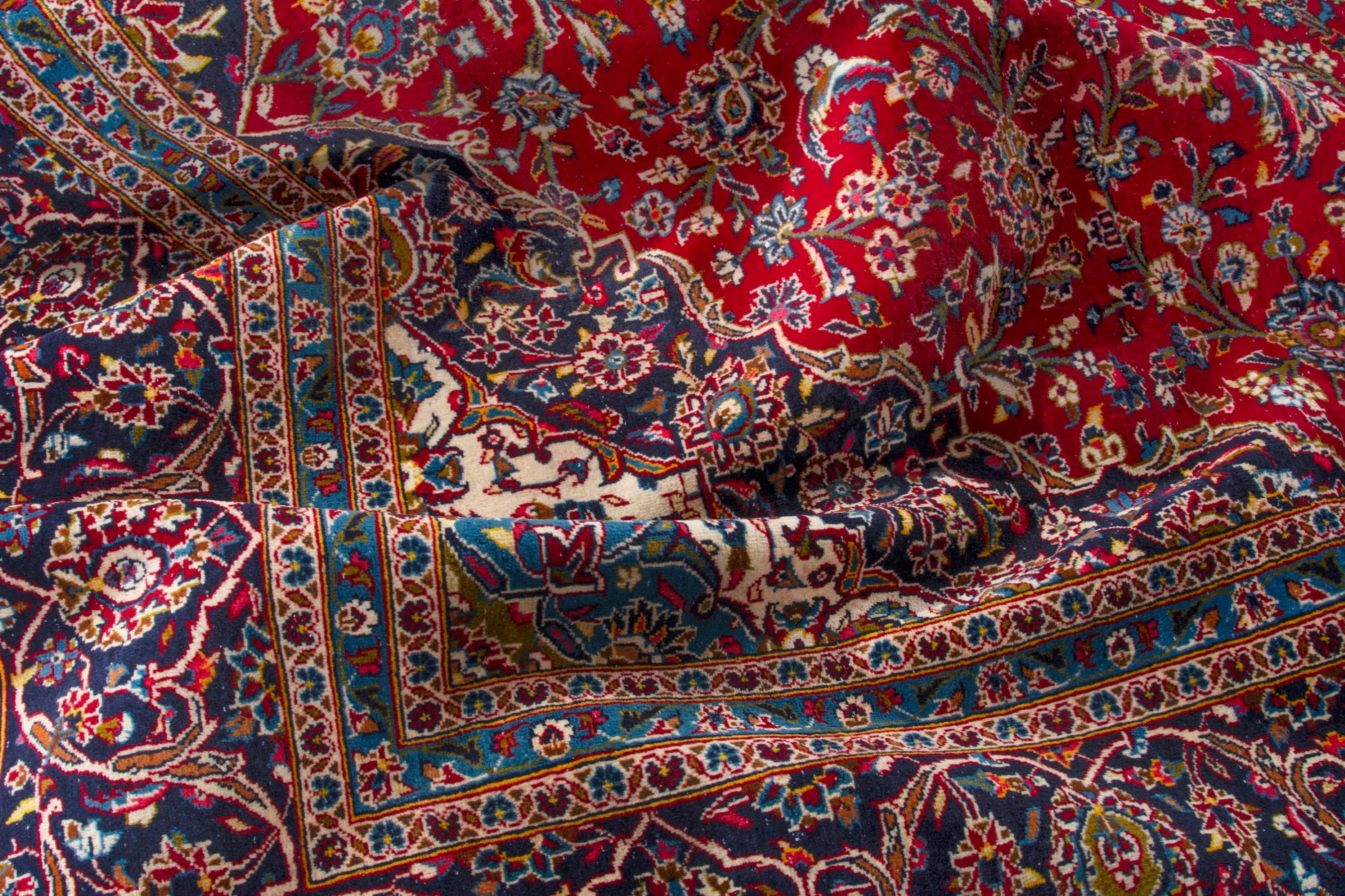 Persian Kashan oversized rug in deep red and navy, view 18 of 20