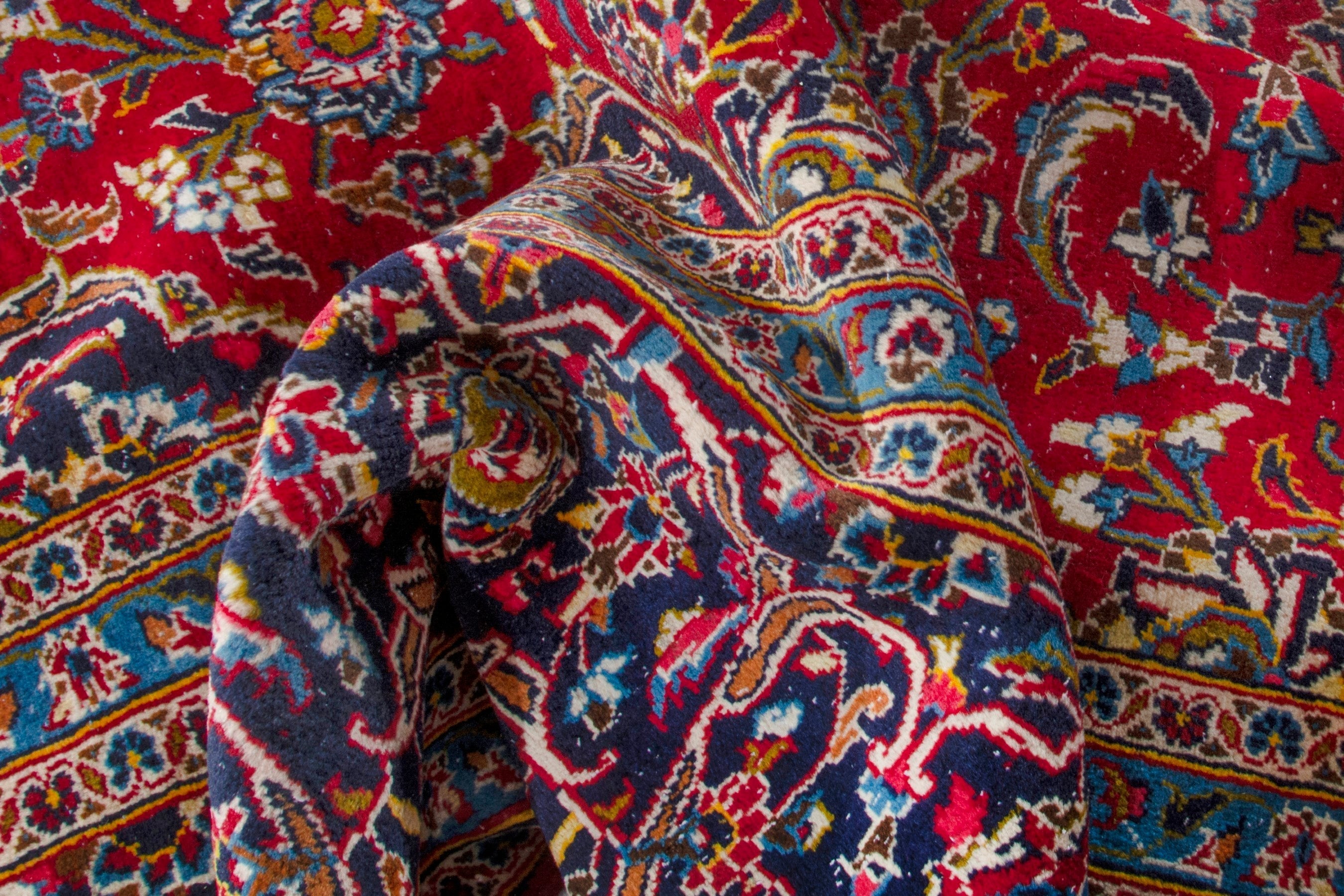 Persian Kashan oversized rug in deep red and navy, view 19 of 20