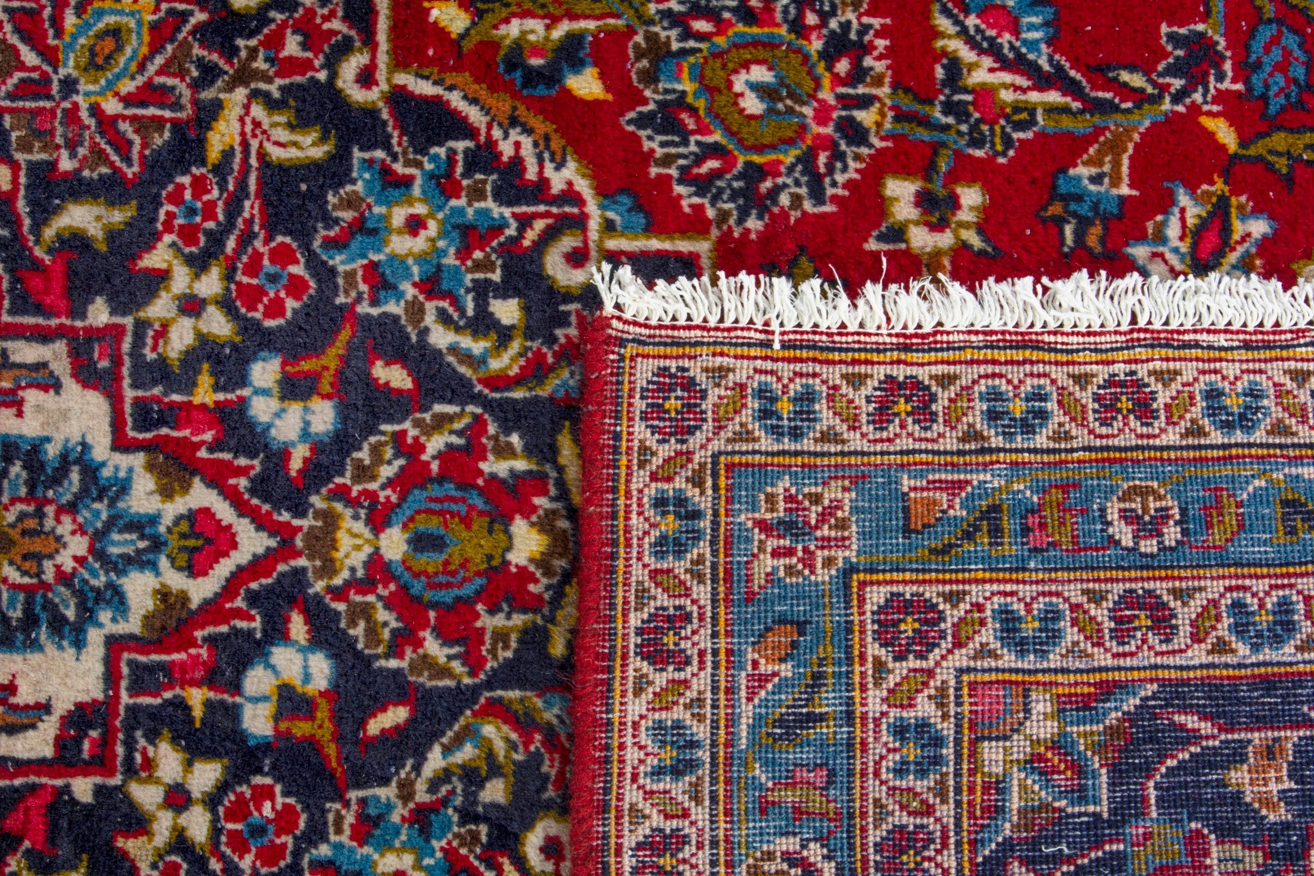 Persian Kashan oversized rug in deep red and navy, view 20 of 20