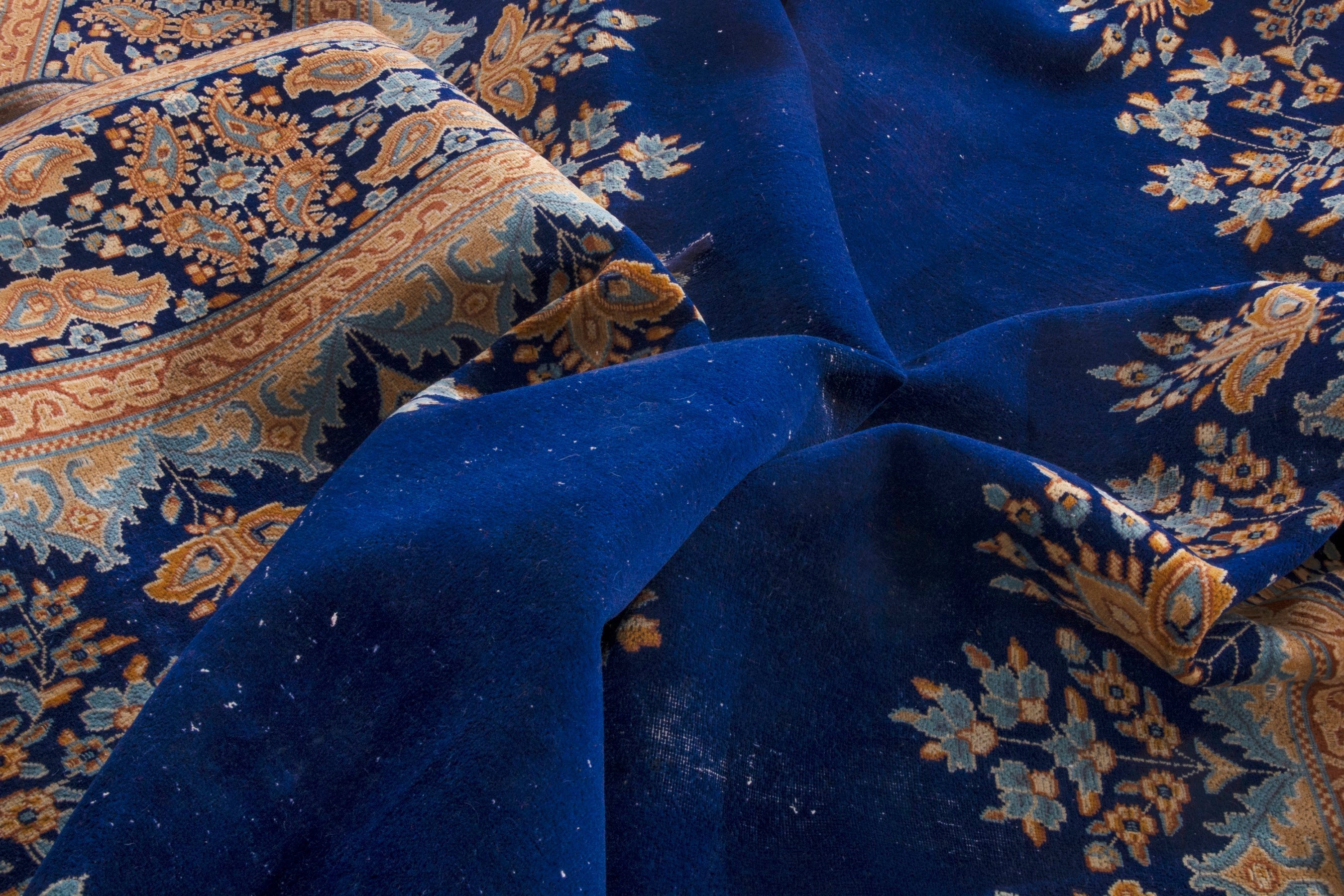 Persian Kerman oversized rug in navy and antique gold, view 22 of 26