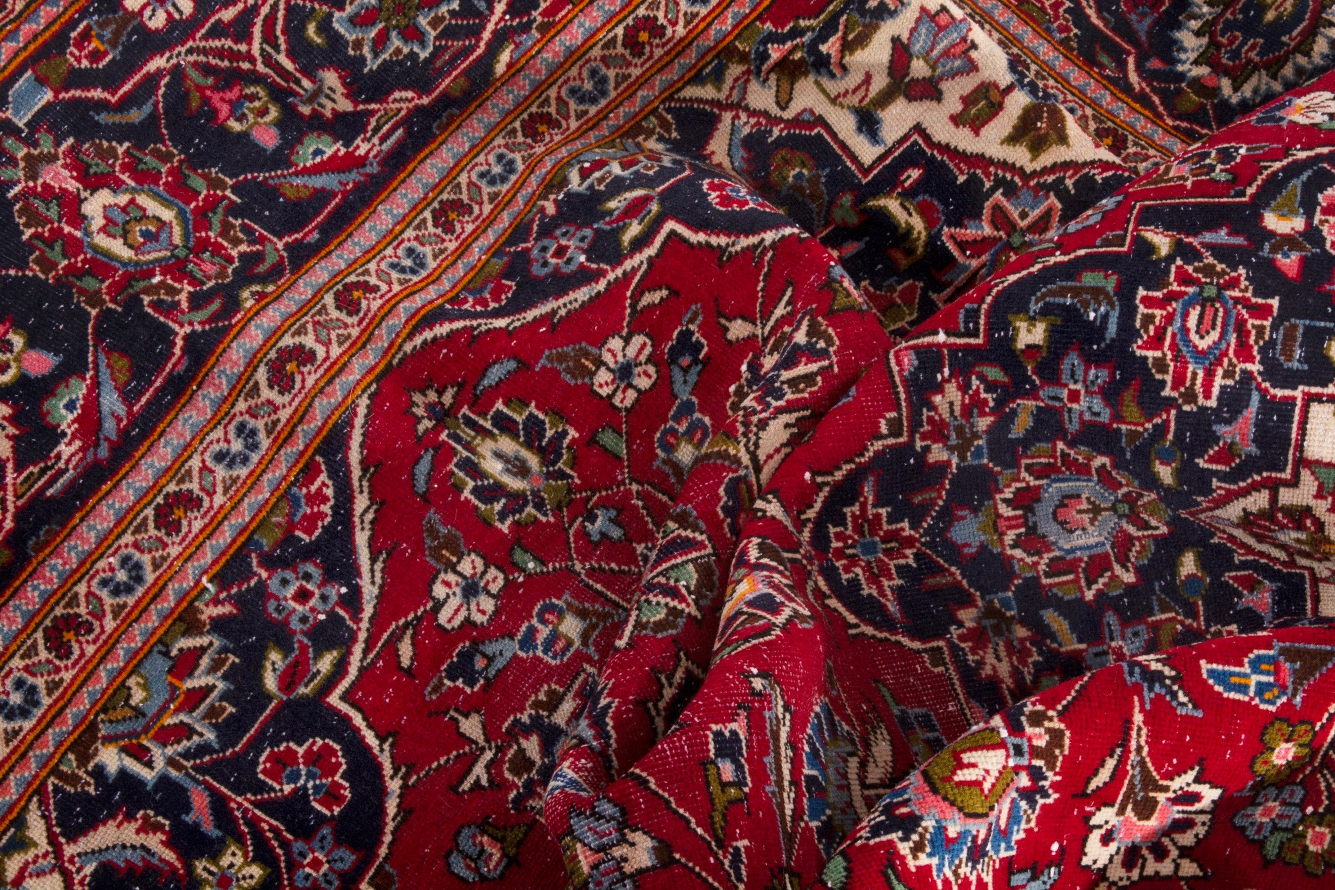Persian Kashan oversized rug in deep red and navy, view 17 of 20