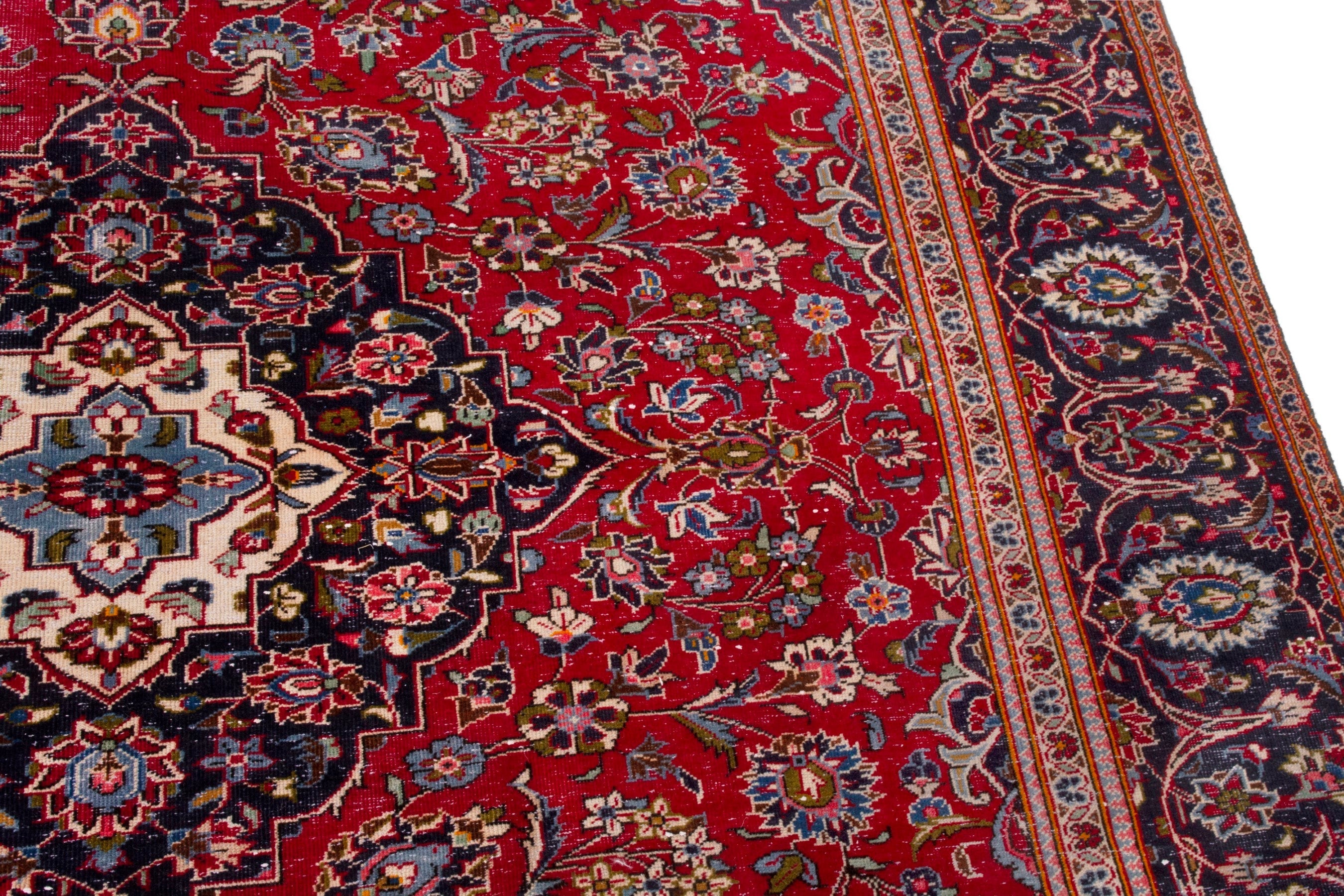 Persian Kashan oversized rug in deep red and navy, view 7 of 20