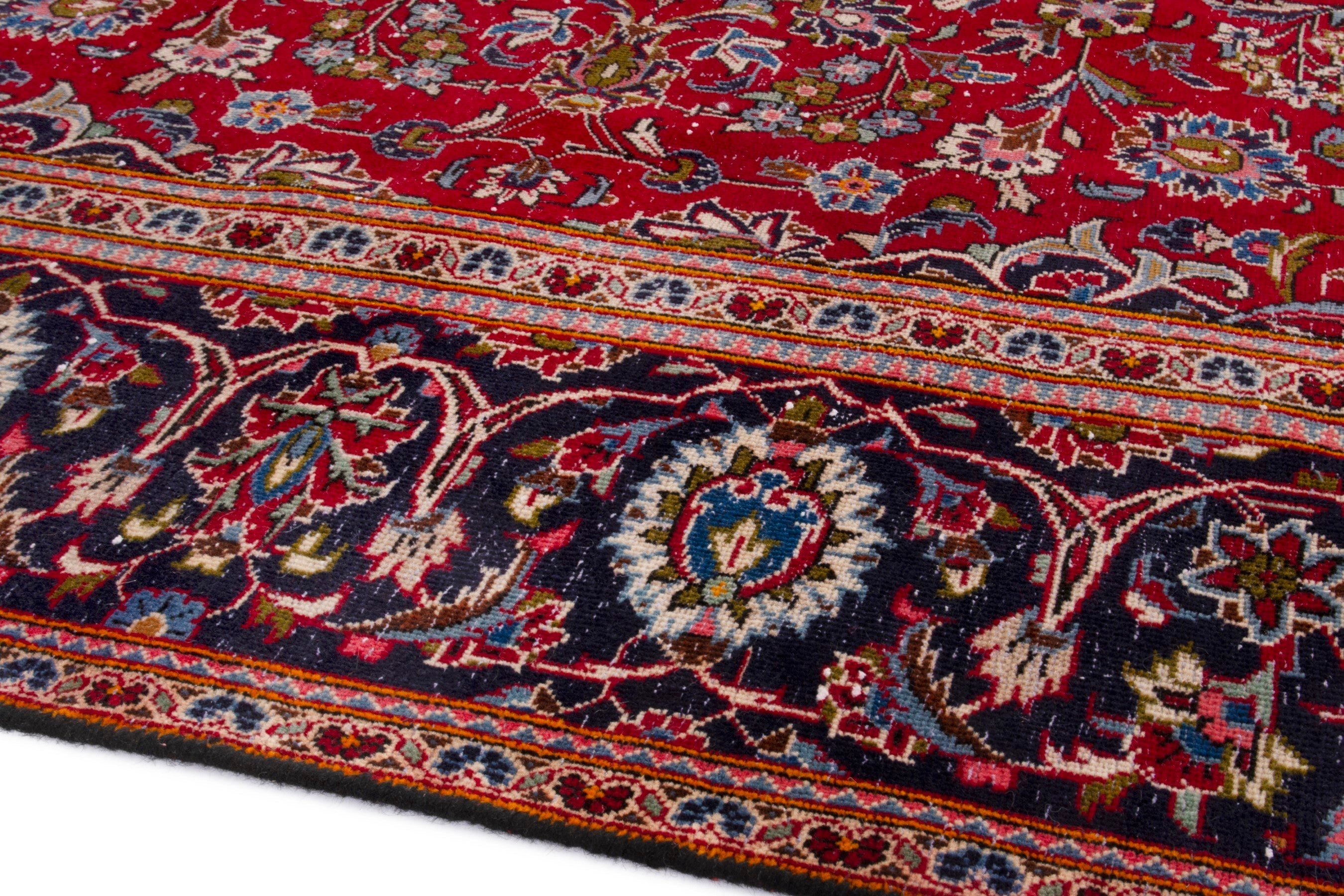 Persian Kashan oversized rug in deep red and navy, view 6 of 20