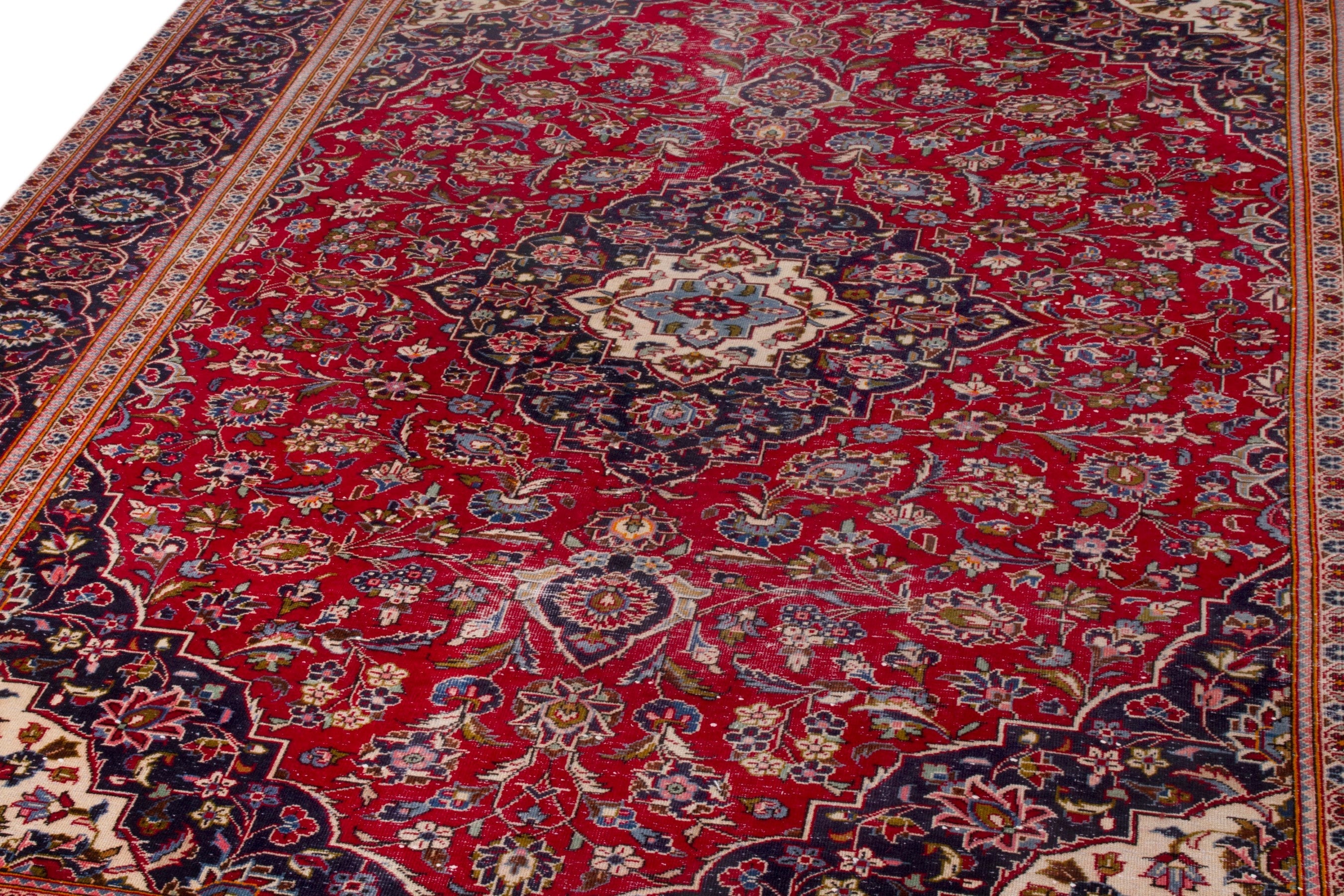 Persian Kashan oversized rug in deep red and navy, view 8 of 20