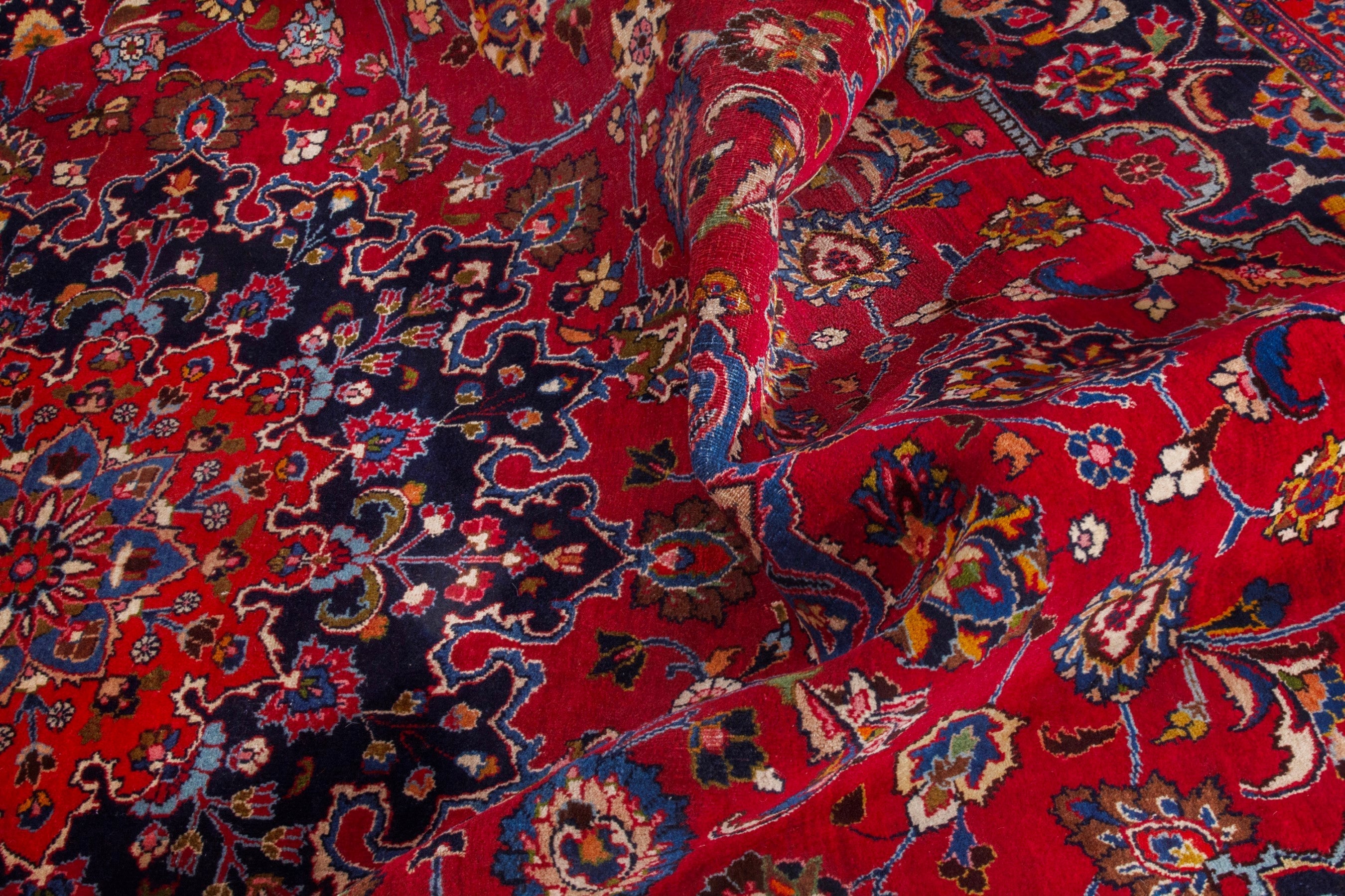 Persian Mashhad oversized rug in deep red and dark blue, view 21 of 22