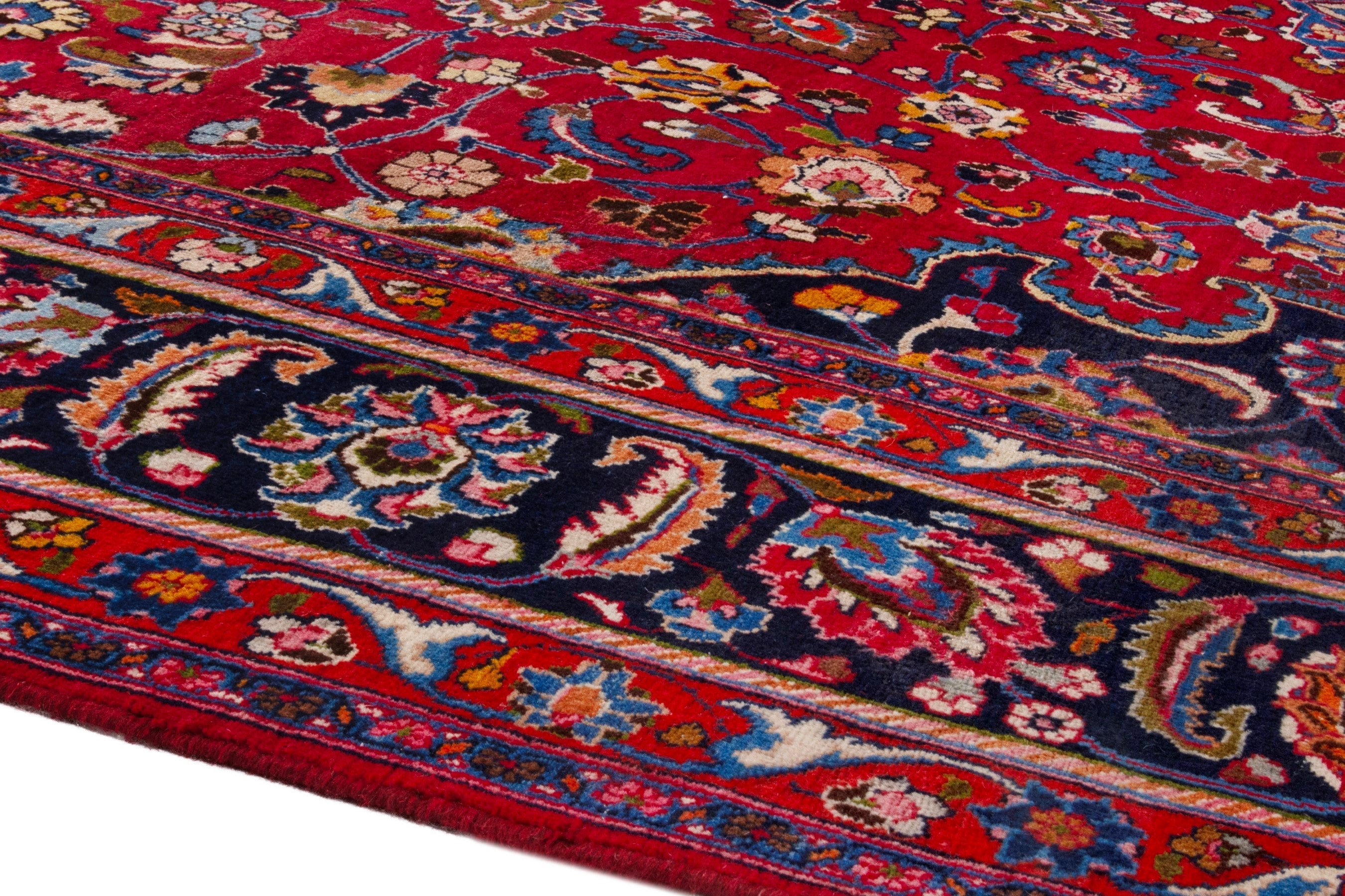 Persian Mashhad oversized rug in deep red and dark blue, view 6 of 22