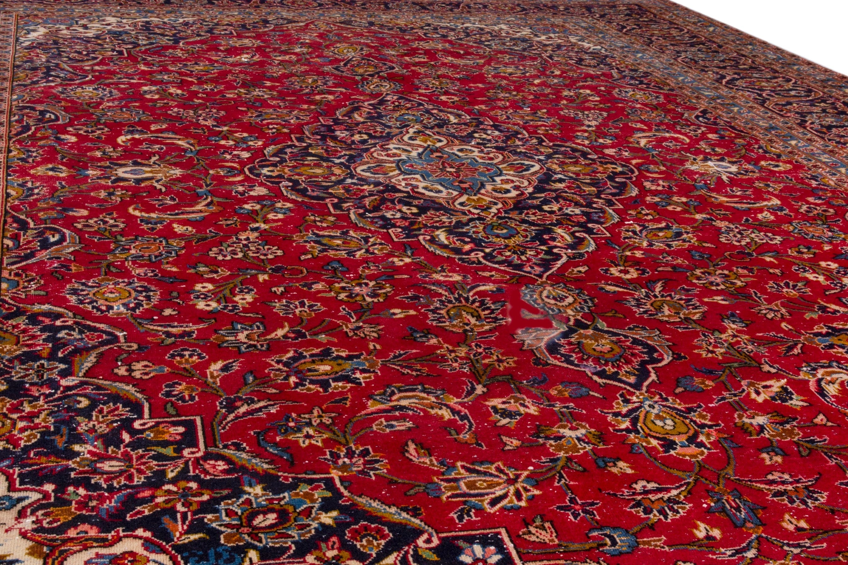Persian Kashan oversized rug in deep red and navy, view 9 of 23