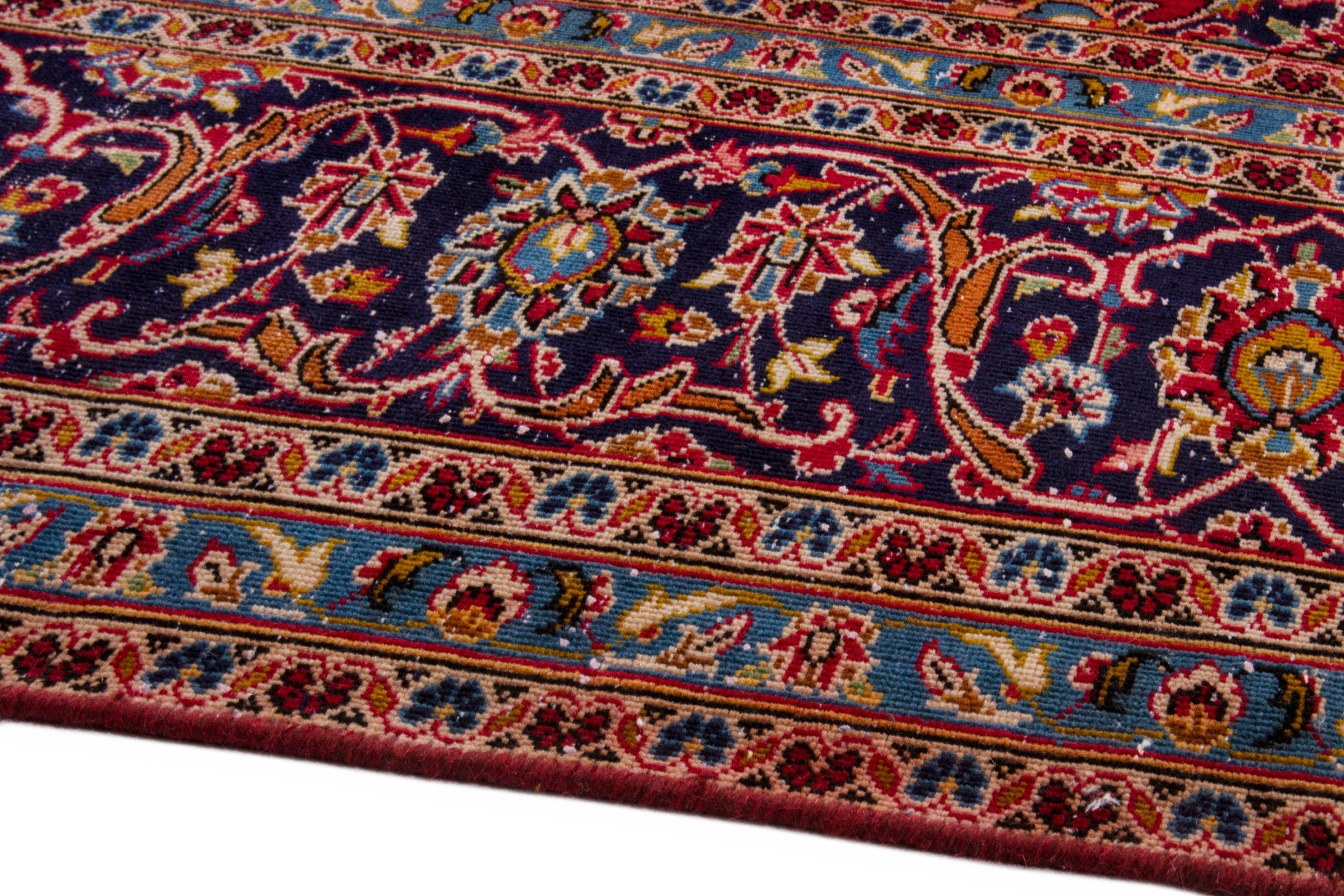 Persian Kashan oversized rug in deep red and navy, view 6 of 23