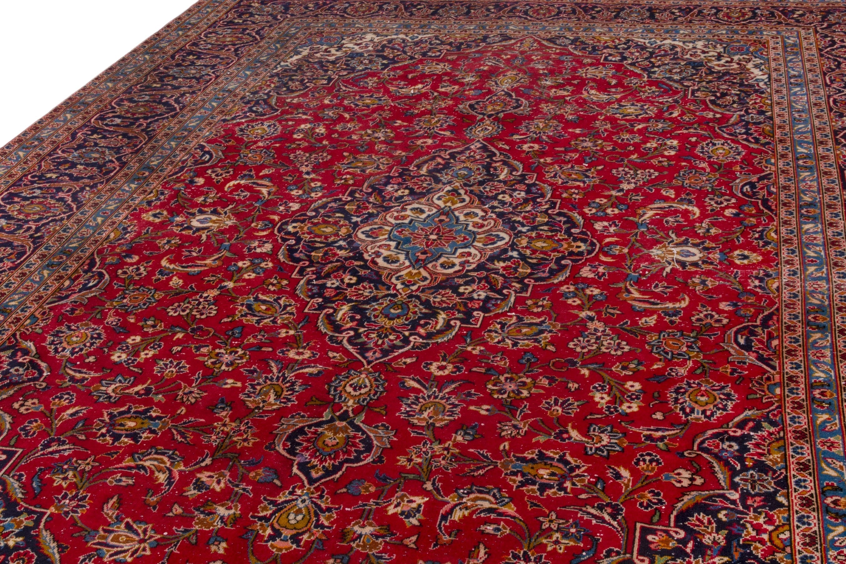 Persian Kashan oversized rug in deep red and navy, view 8 of 23