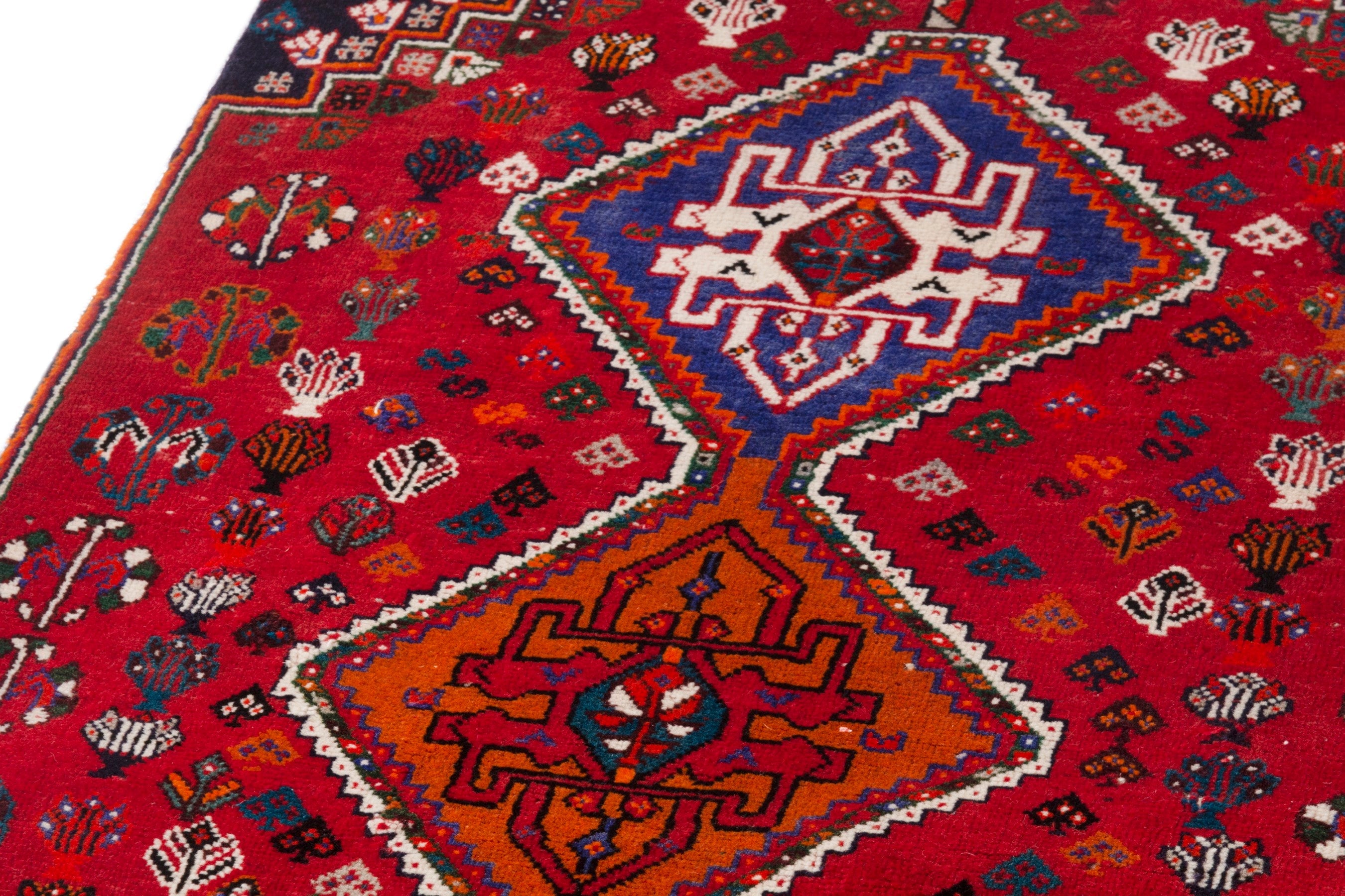 Persian Shiraz accent rug in deep red and denim, view 9 of 12