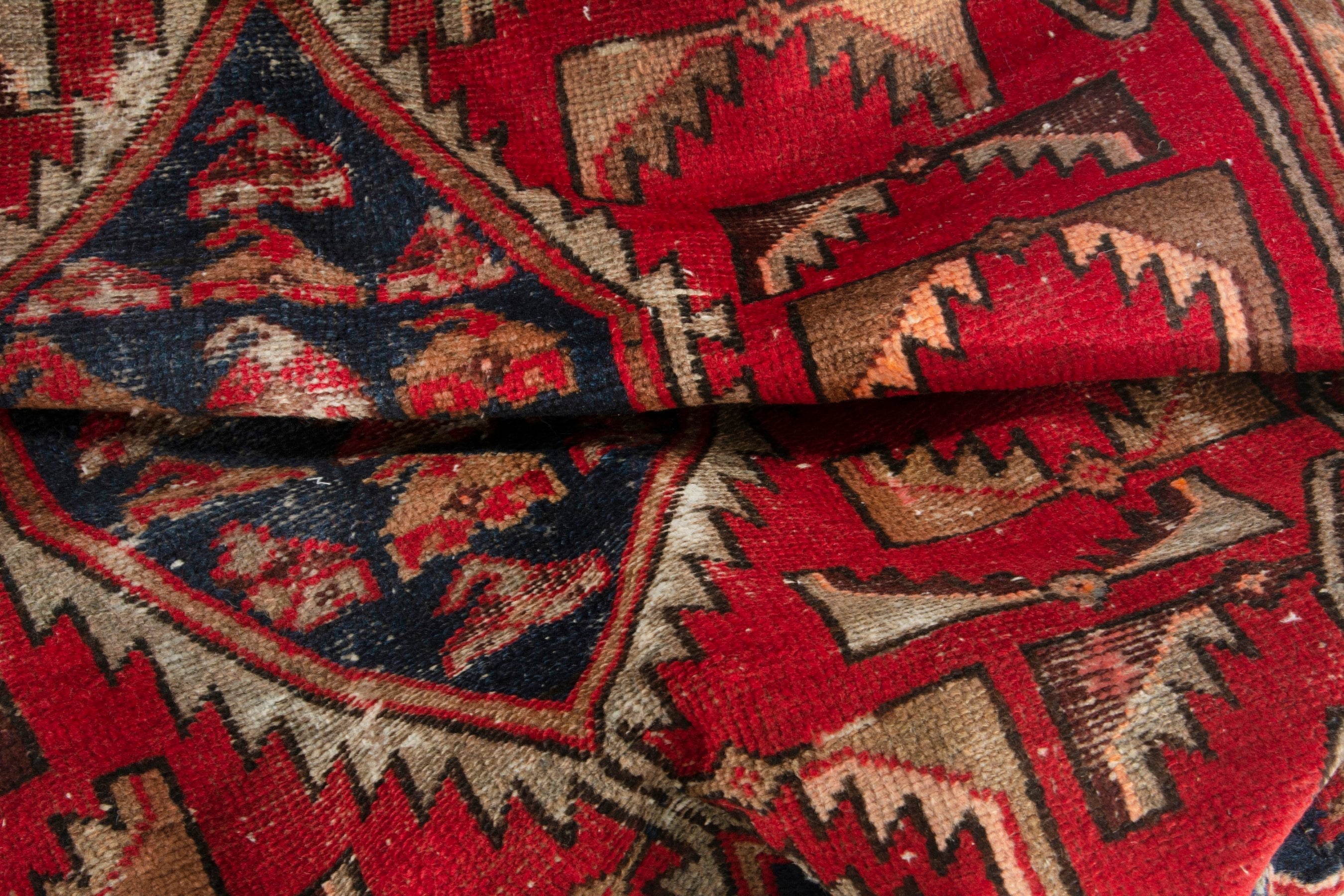 Persian Saveh accent rug in deep red and navy, view 15 of 17