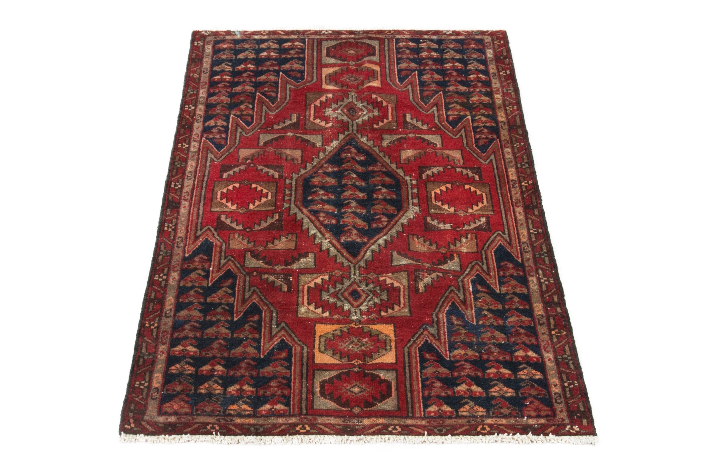 Persian Saveh accent rug in deep red and navy, view 3 of 17