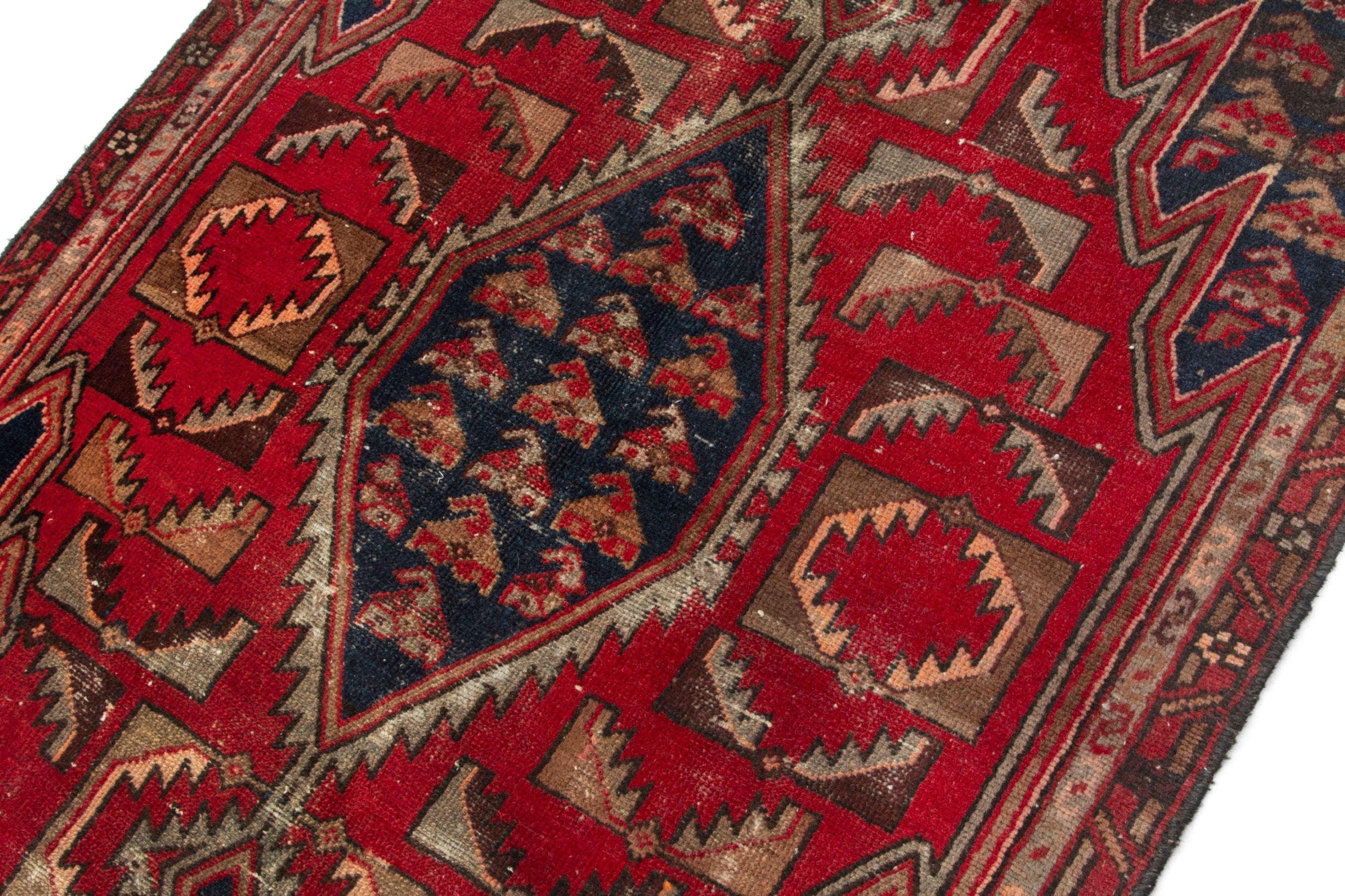 Persian Saveh accent rug in deep red and navy, view 7 of 17