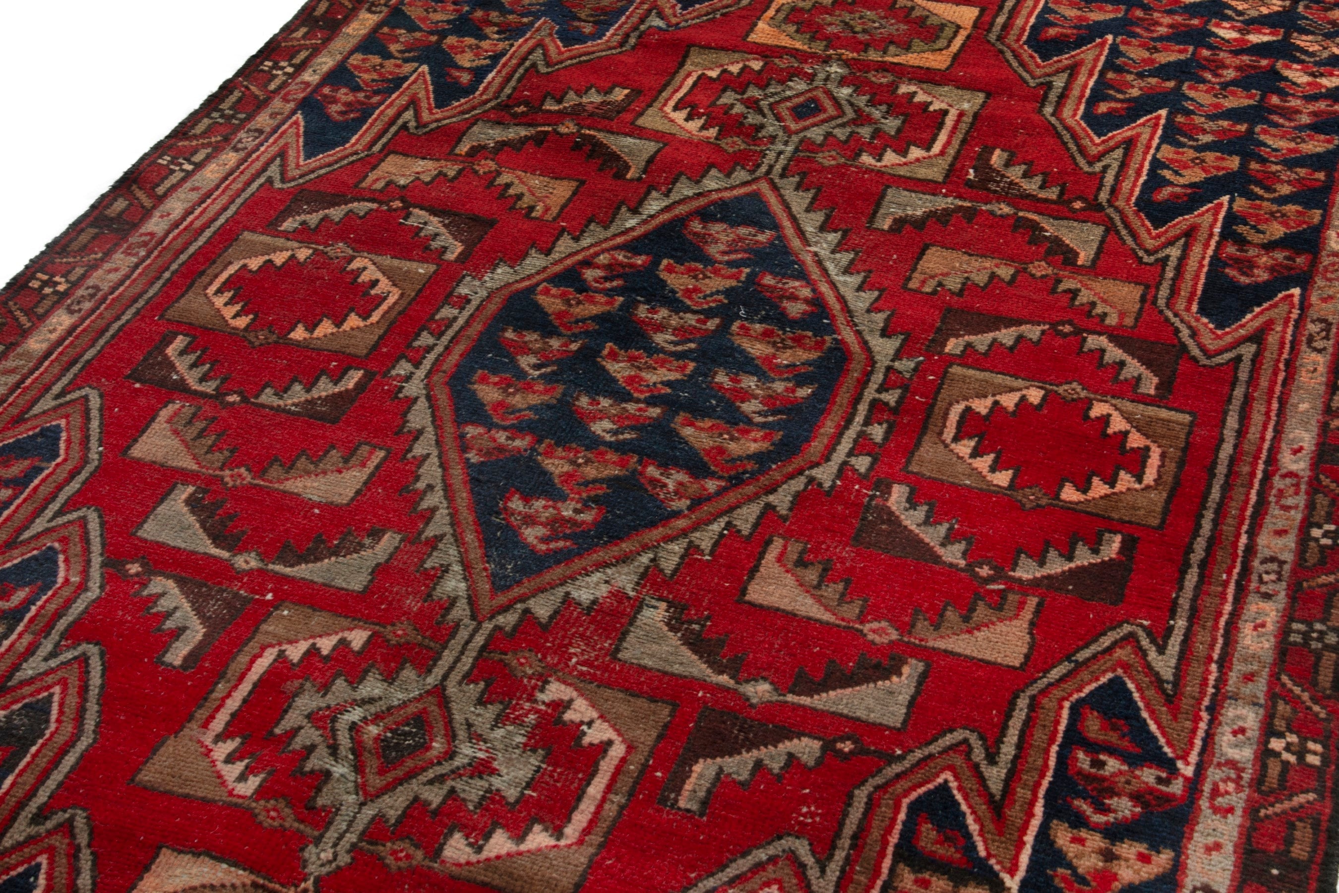 Persian Saveh accent rug in deep red and navy, view 8 of 17
