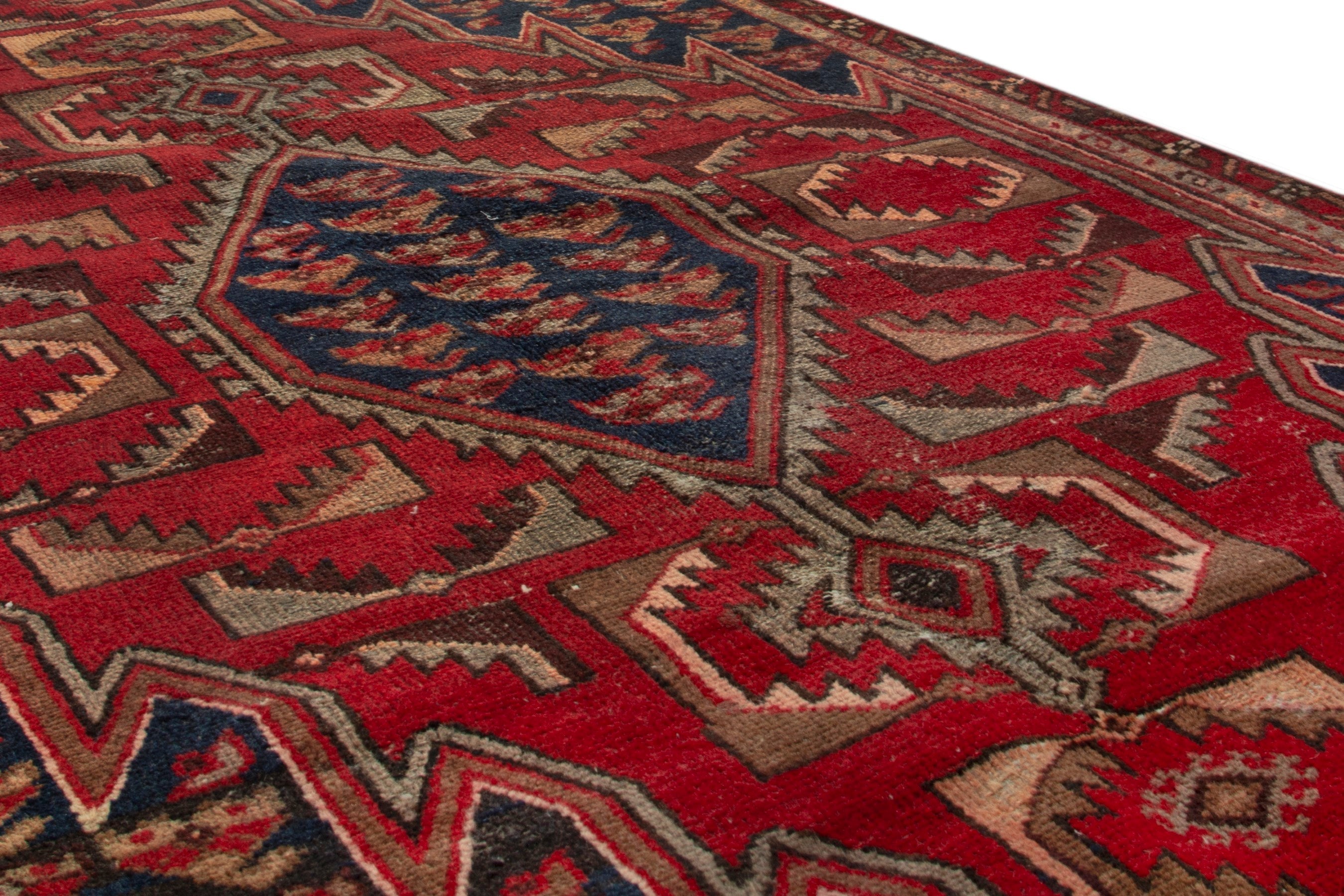 Persian Saveh accent rug in deep red and navy, view 6 of 17