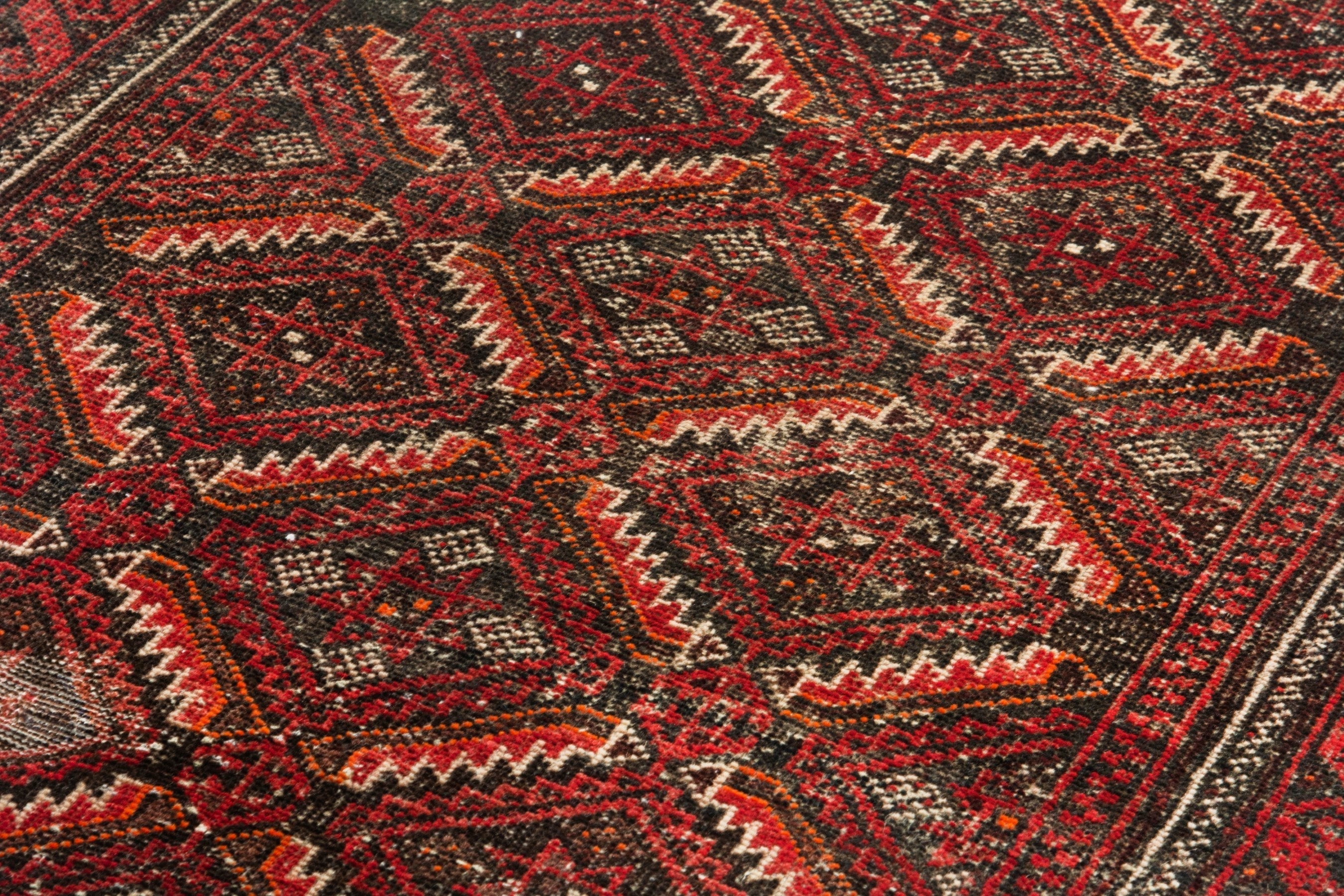 Persian Baluch accent rug in deep red and burgundy, view 8 of 18