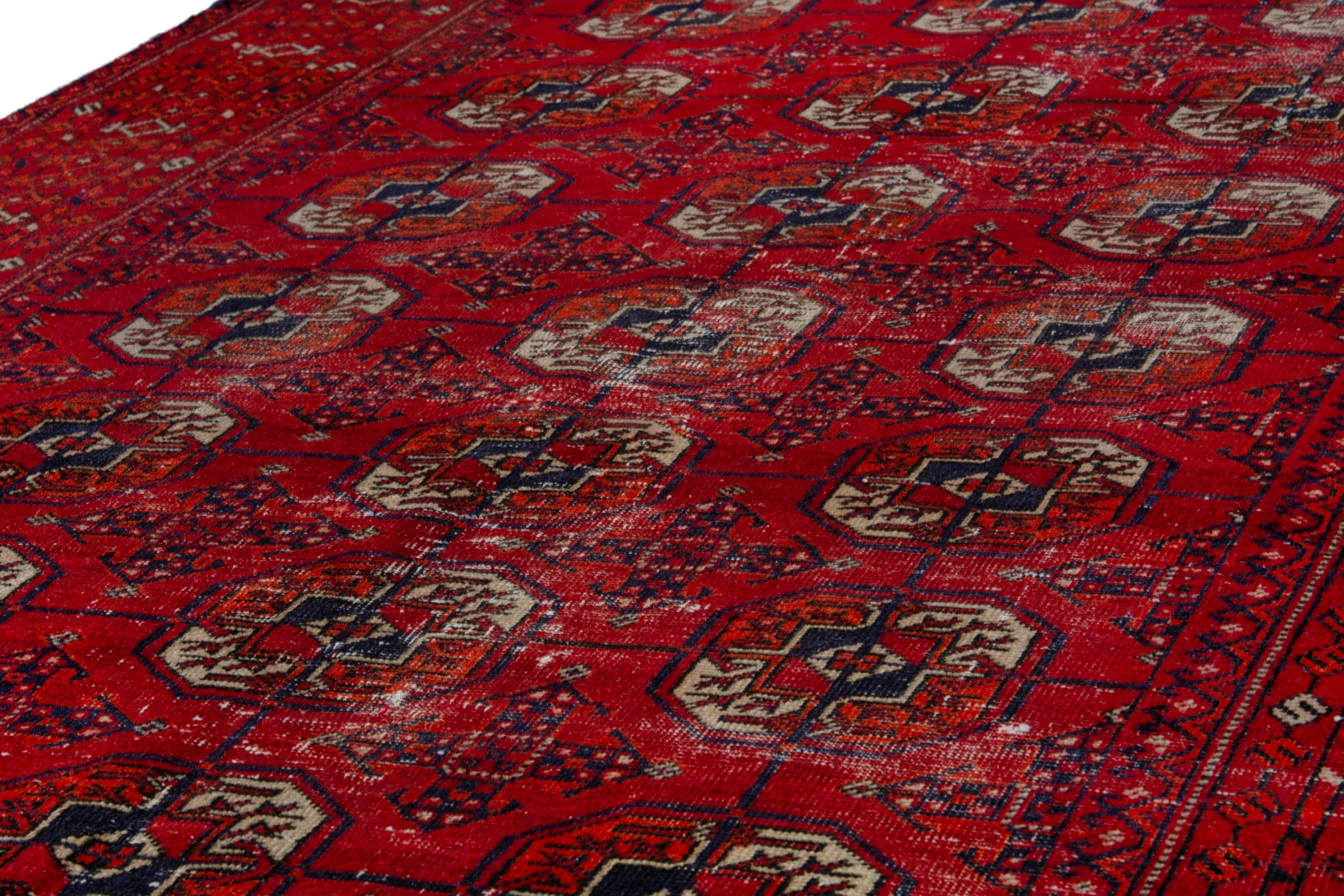 Persian Torkaman area rug in deep red and muted yellow, view 8 of 20