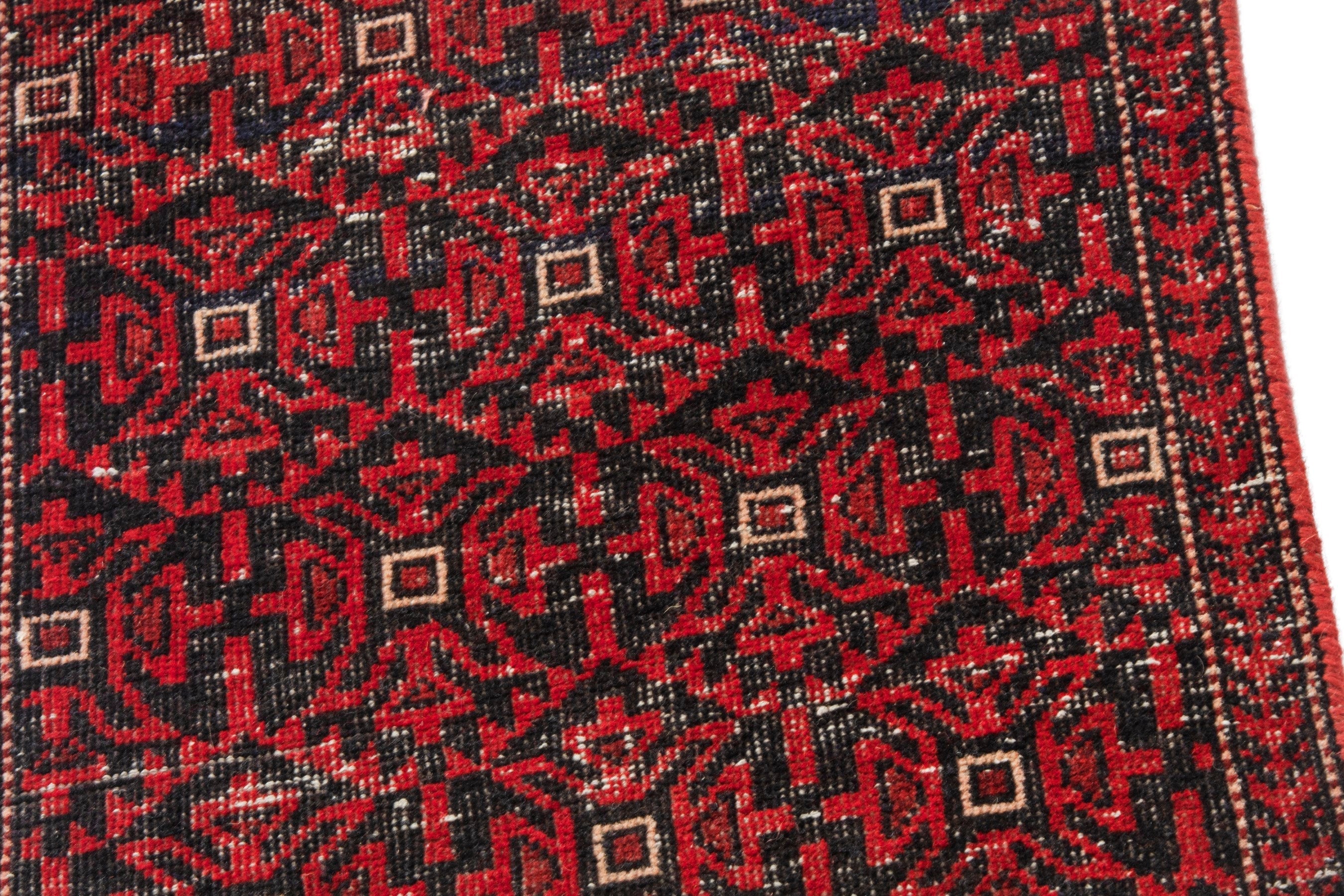 Persian Baluch accent rug in deep red and burgundy, view 7 of 16