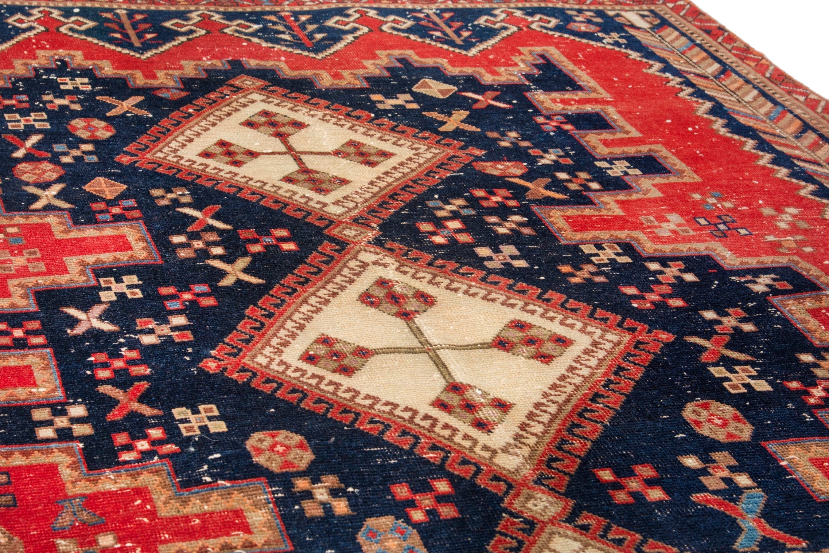 Persian Sirjan accent rug in deep red and navy, view 9 of 18