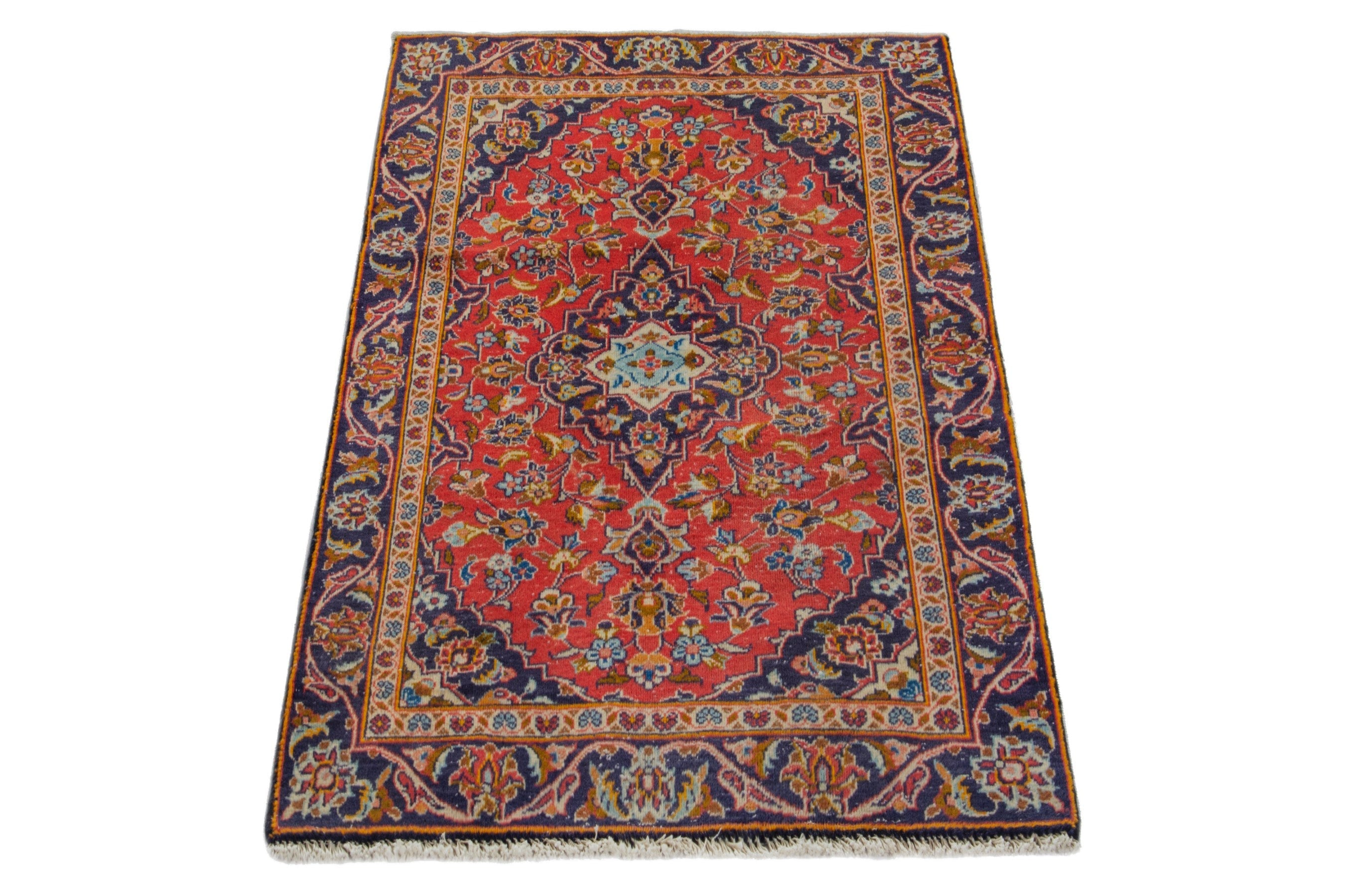 Persian Kashan accent rug in deep red and navy, view 2 of 17