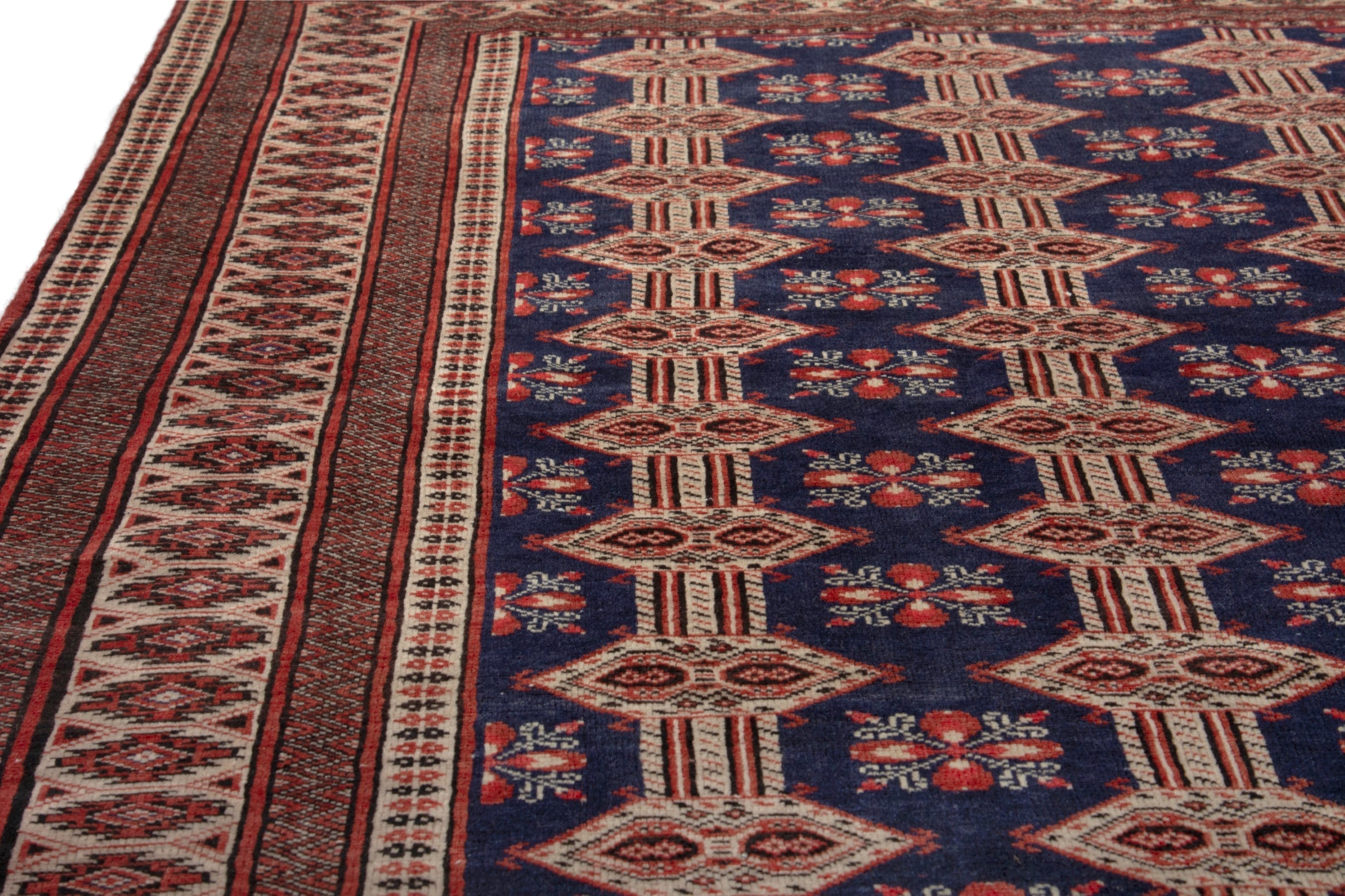 Persian Torkaman accent rug in navy and rust, view 9 of 19