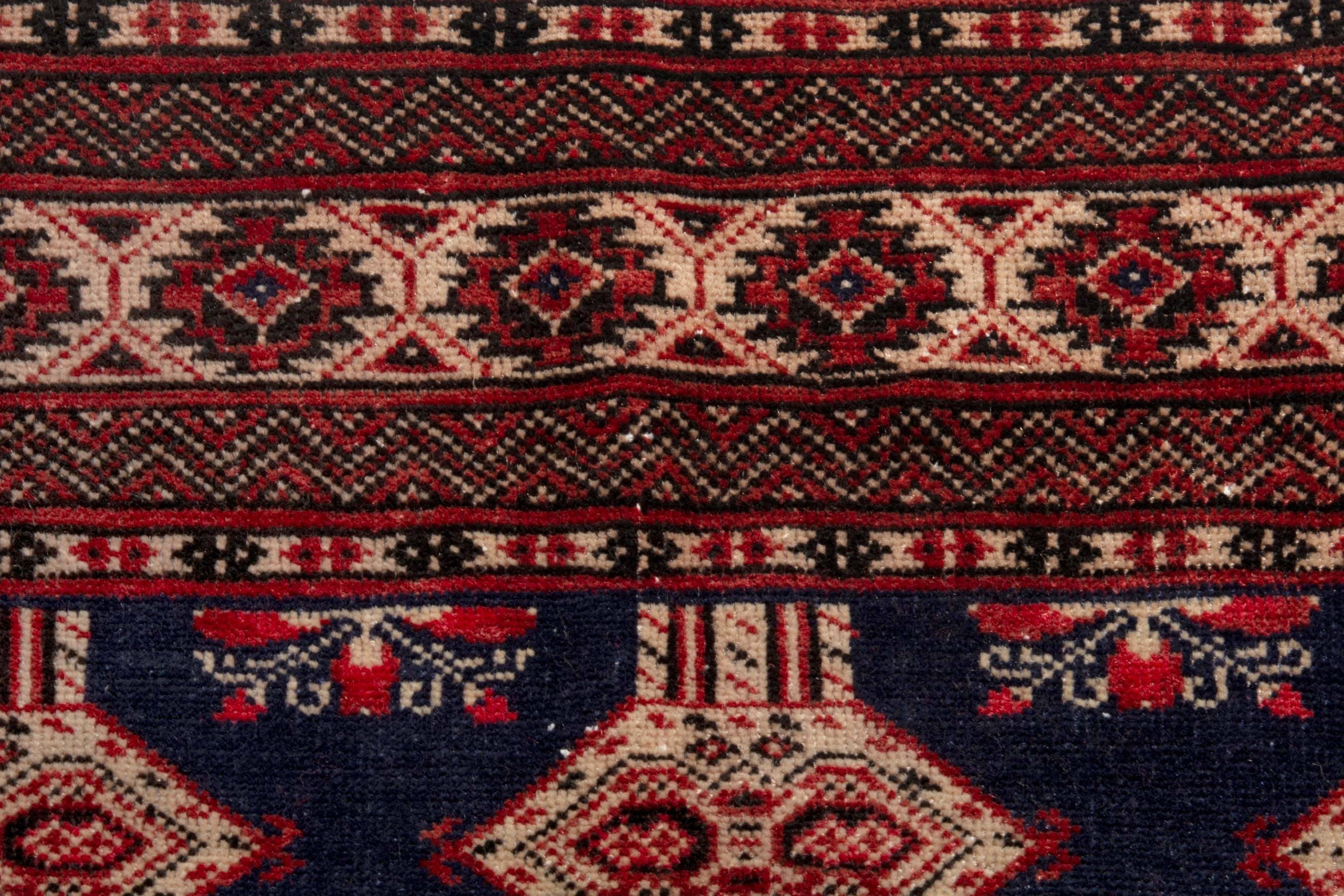 Persian Torkaman accent rug in navy and rust, view 12 of 19
