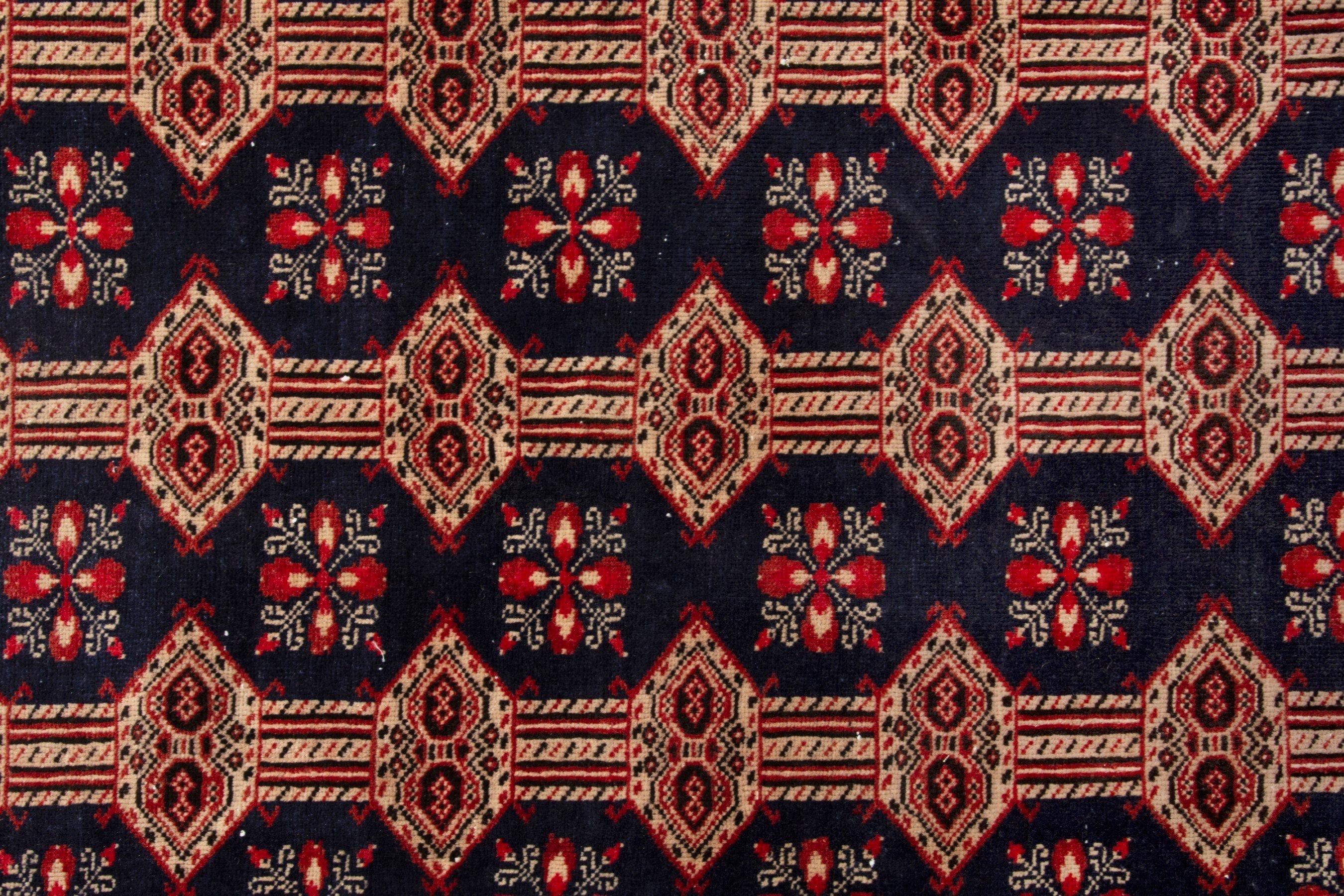 Persian Torkaman accent rug in navy and rust, view 15 of 19