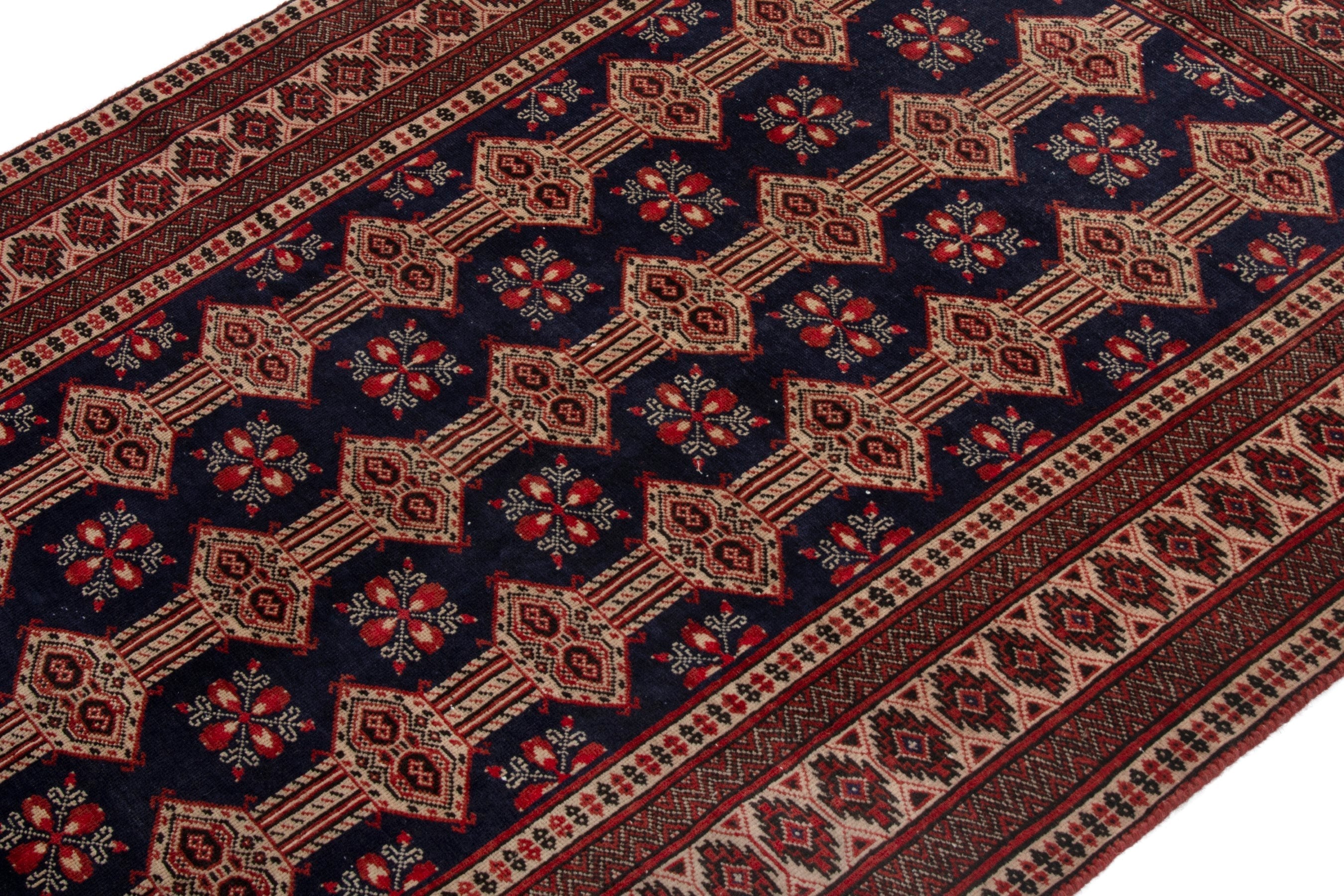 Persian Torkaman accent rug in navy and rust, view 5 of 19