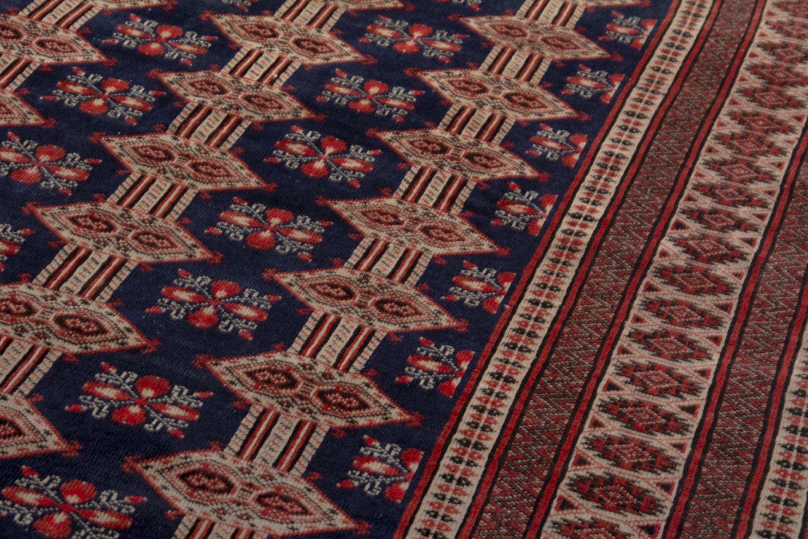 Persian Torkaman accent rug in navy and rust, view 8 of 19