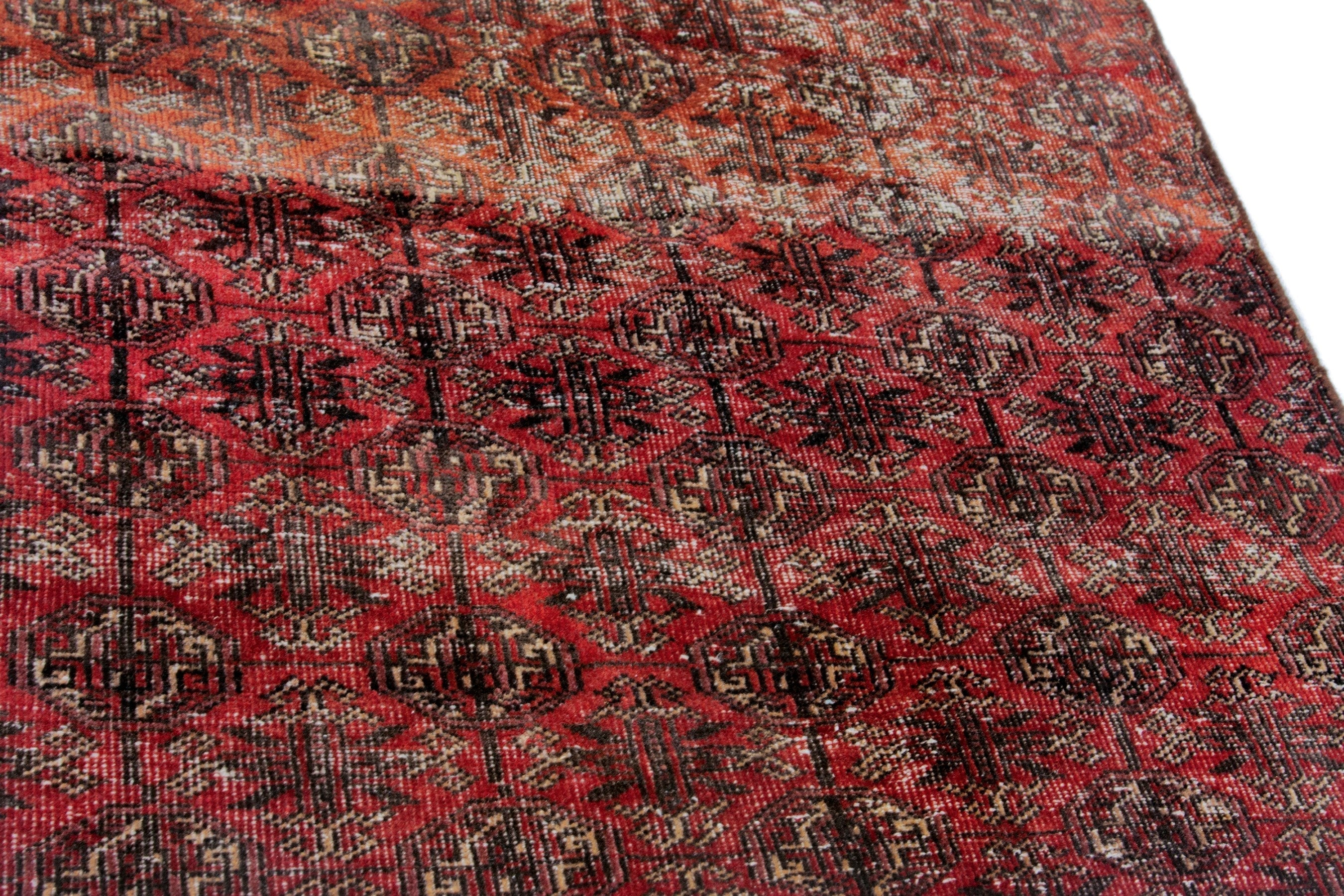 Persian Baluch accent rug in burgundy and faded red, view 7 of 18