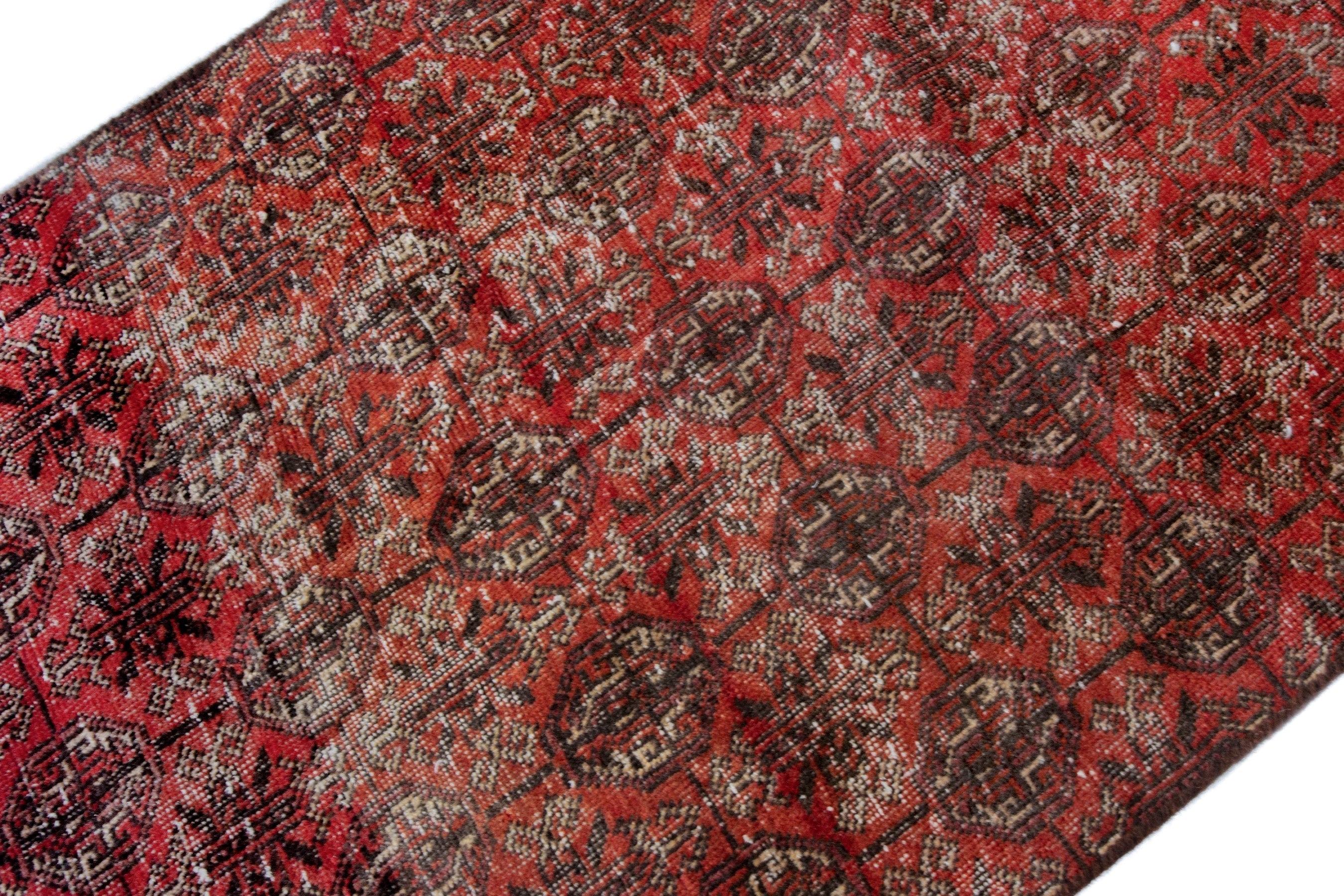 Persian Baluch accent rug in burgundy and faded red, view 8 of 18