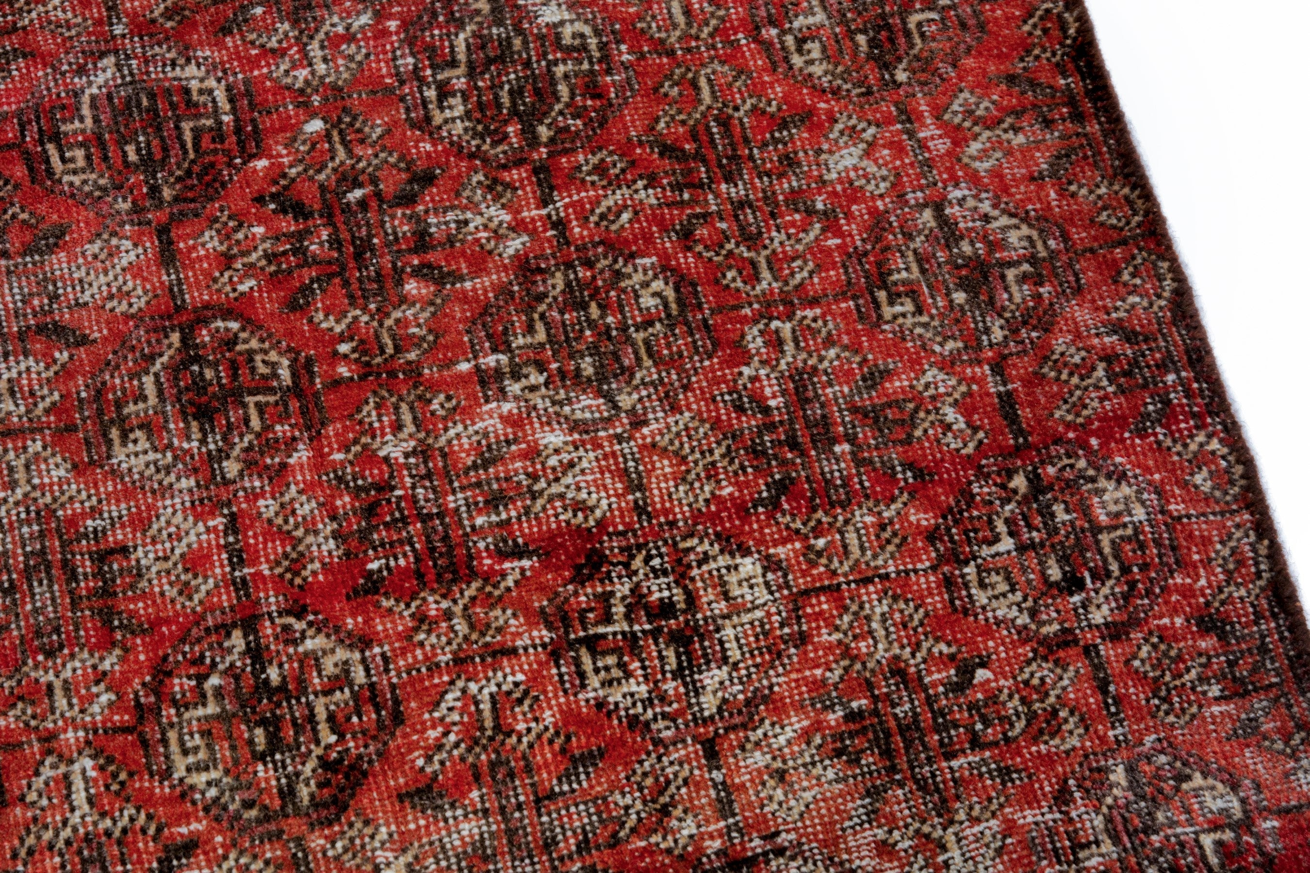 Persian Baluch accent rug in burgundy and faded red, view 4 of 18