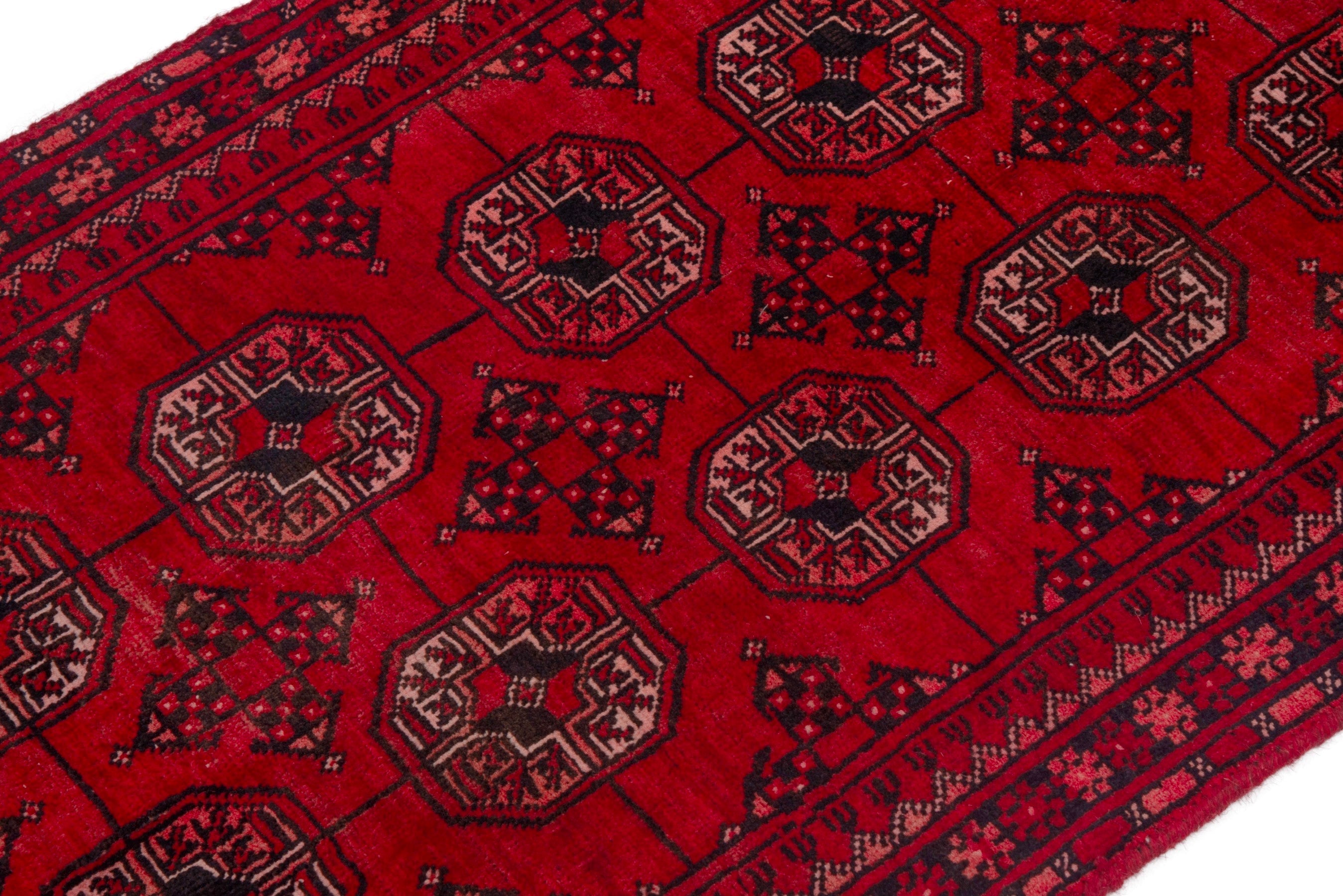Persian Baluch rug in deep red and faded red, view 7 of 18