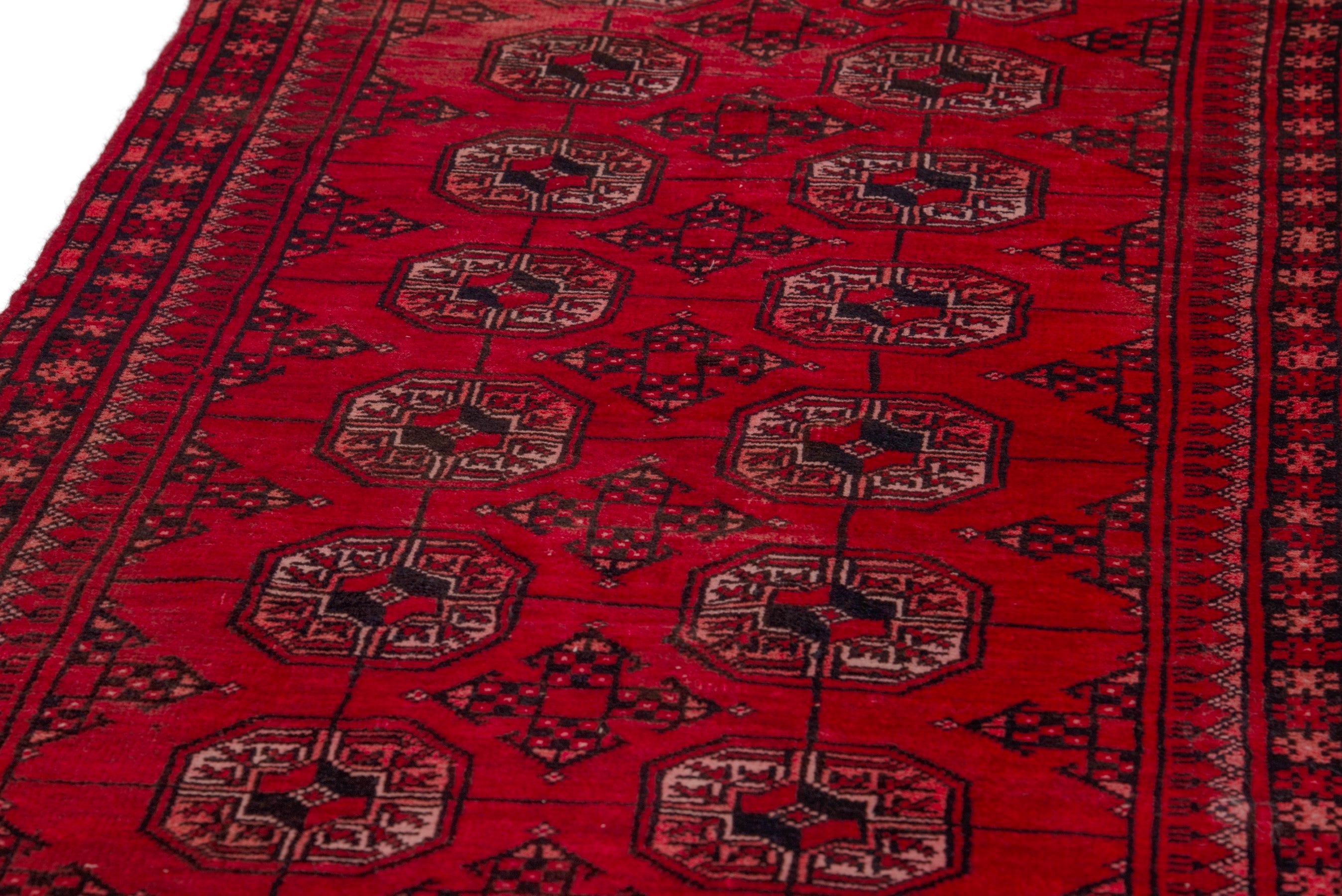 Persian Baluch rug in deep red and faded red, view 8 of 18