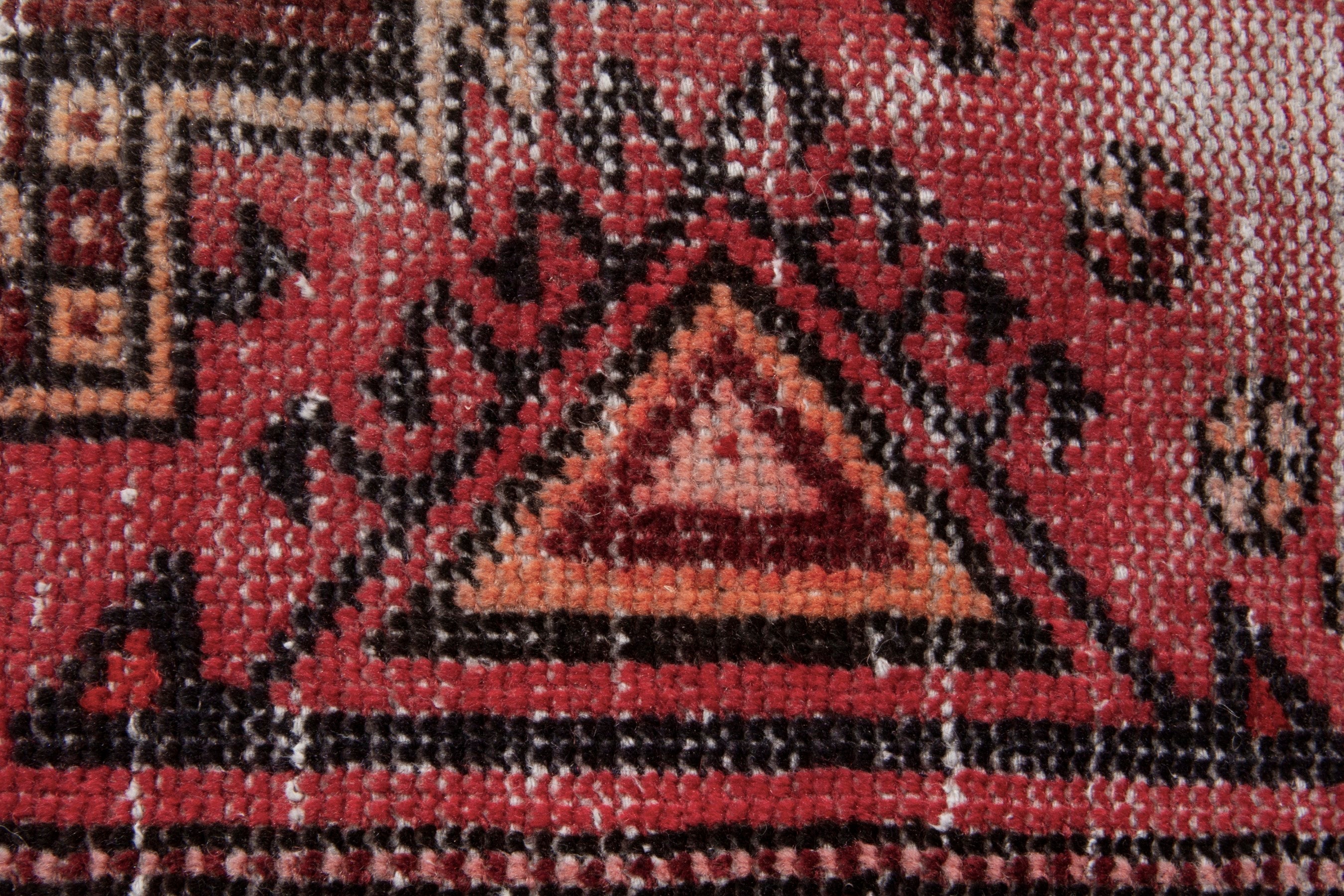 Persian Baluch area rug in faded red and deep red, view 12 of 19