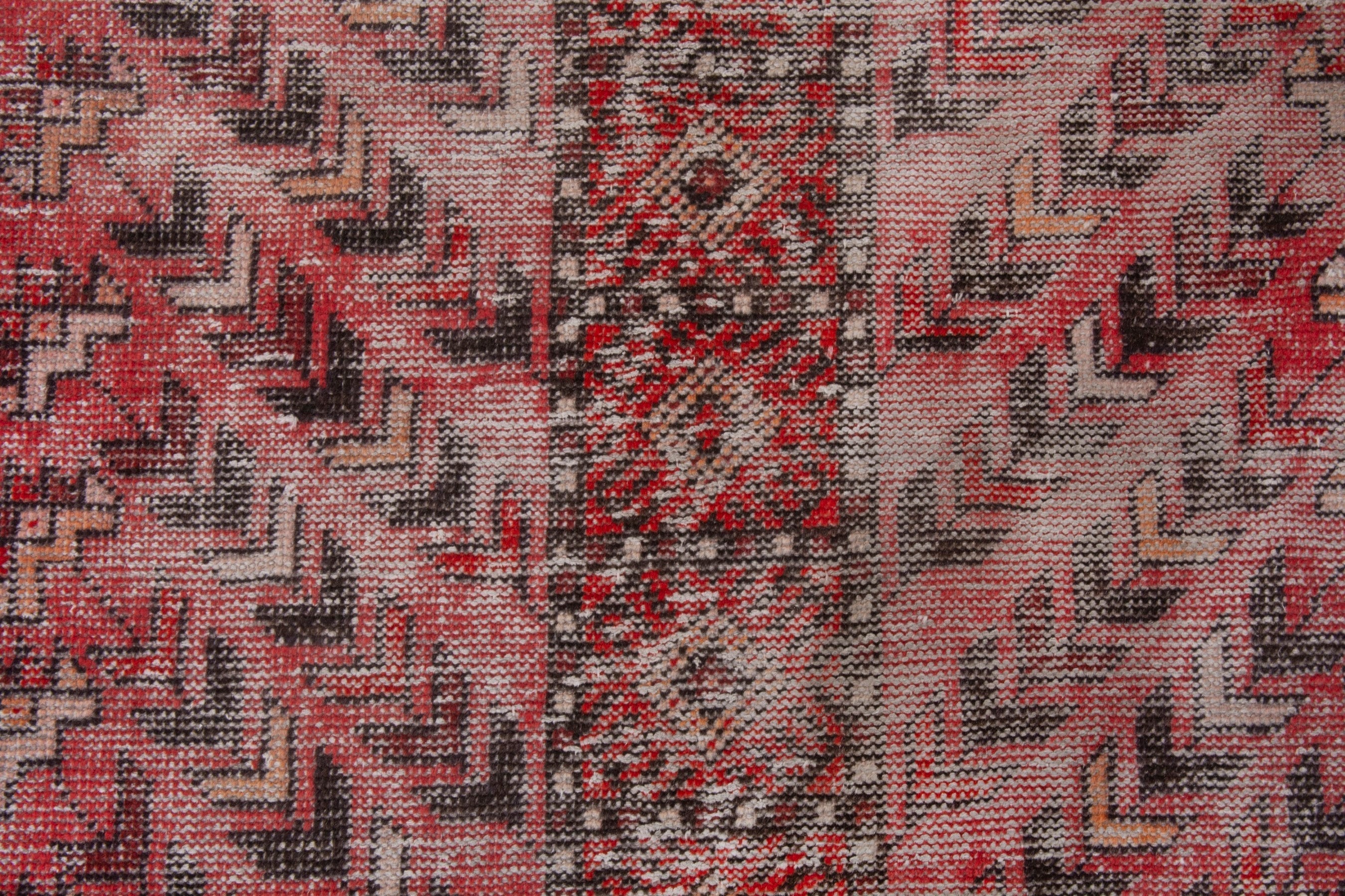 Persian Baluch area rug in faded red and deep red, view 15 of 19