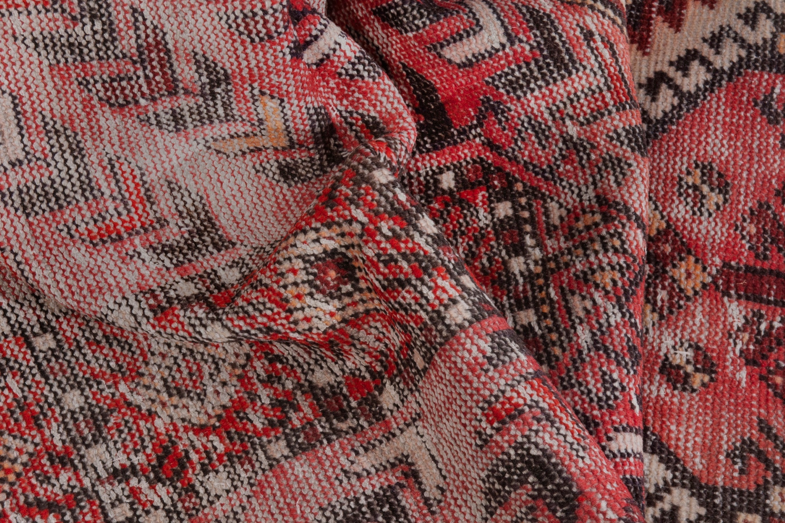 Persian Baluch area rug in faded red and deep red, view 16 of 19