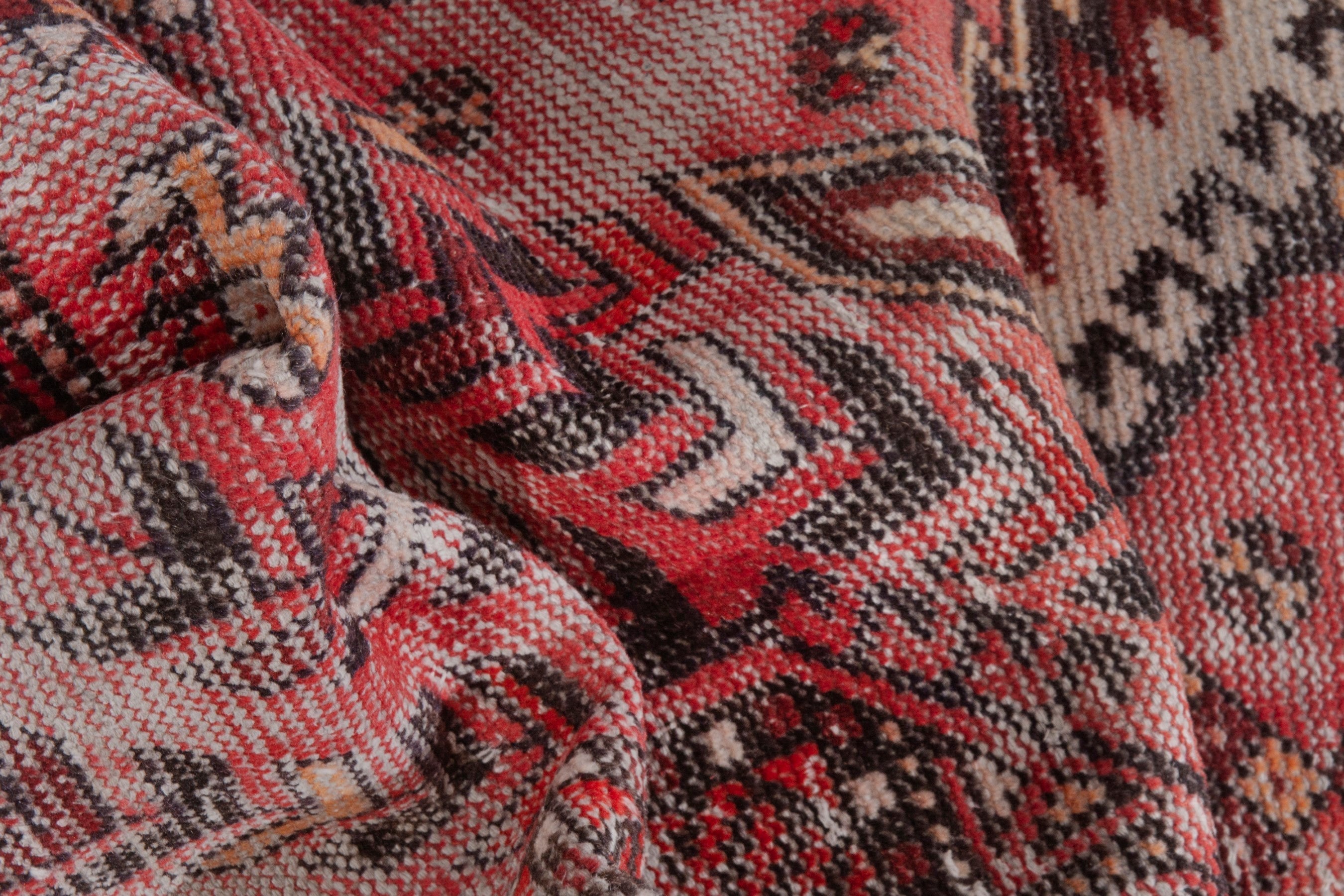 Persian Baluch area rug in faded red and deep red, view 17 of 19