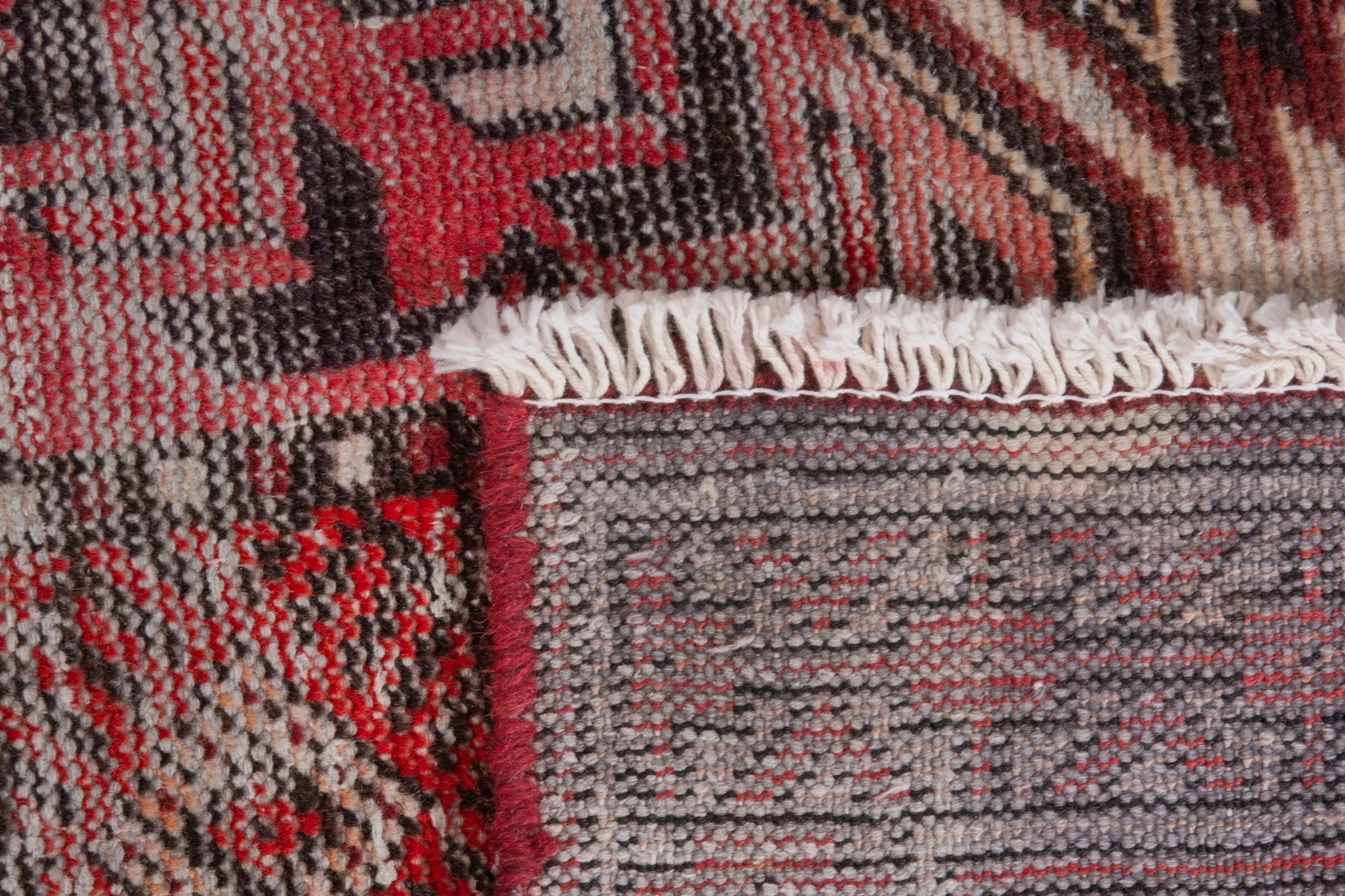 Persian Baluch area rug in faded red and deep red, view 19 of 19