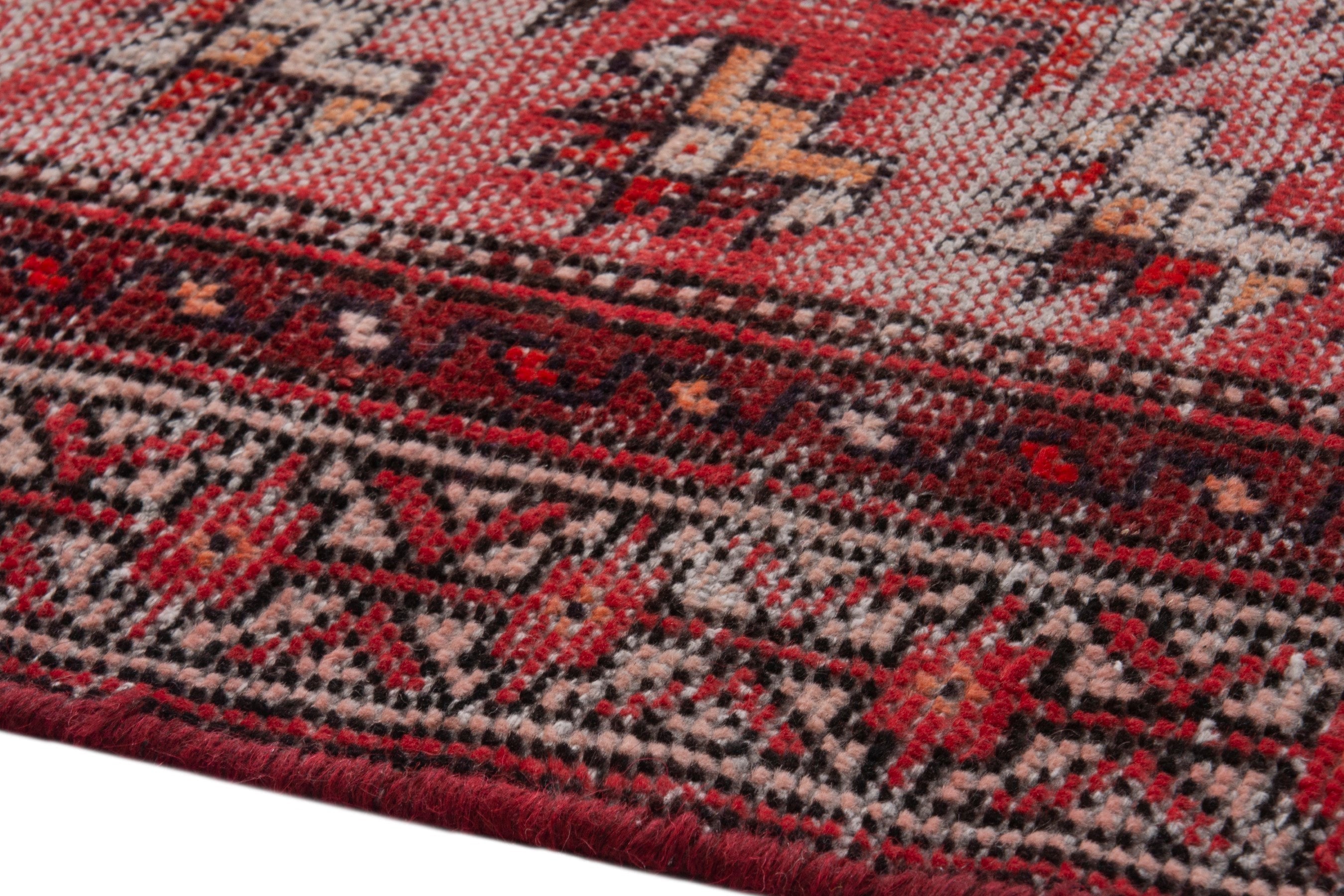 Persian Baluch area rug in faded red and deep red, view 5 of 19