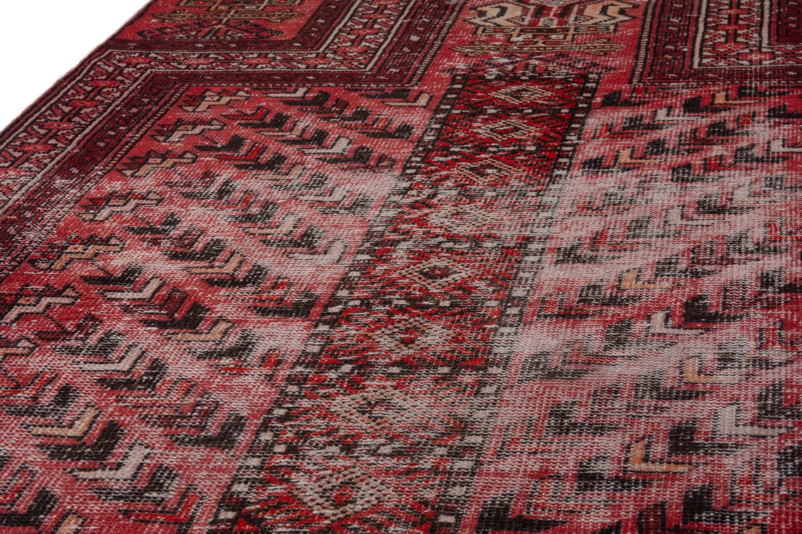 Persian Baluch area rug in faded red and deep red, view 6 of 19