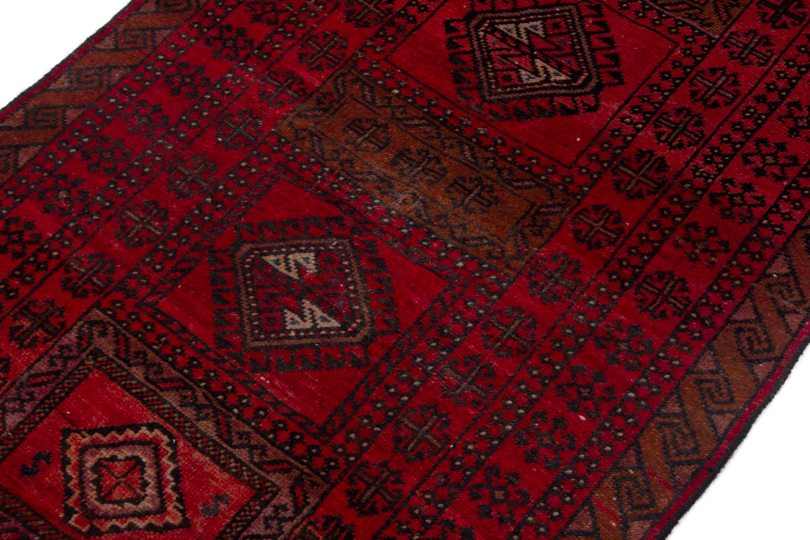 Persian Baluch accent rug in deep red and burgundy, view 4 of 17