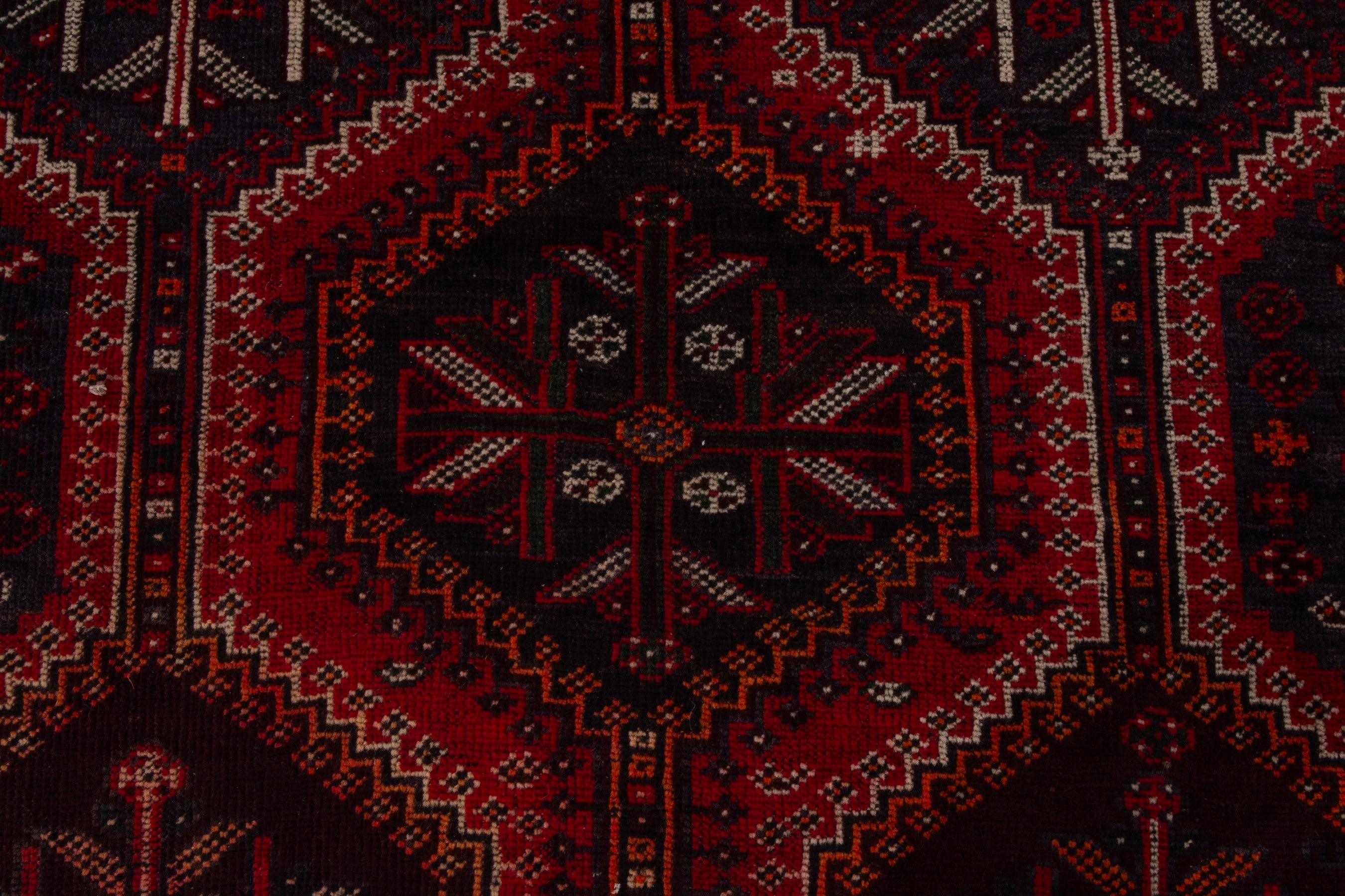 Persian Shiraz area rug in burgundy and deep red, view 11 of 18
