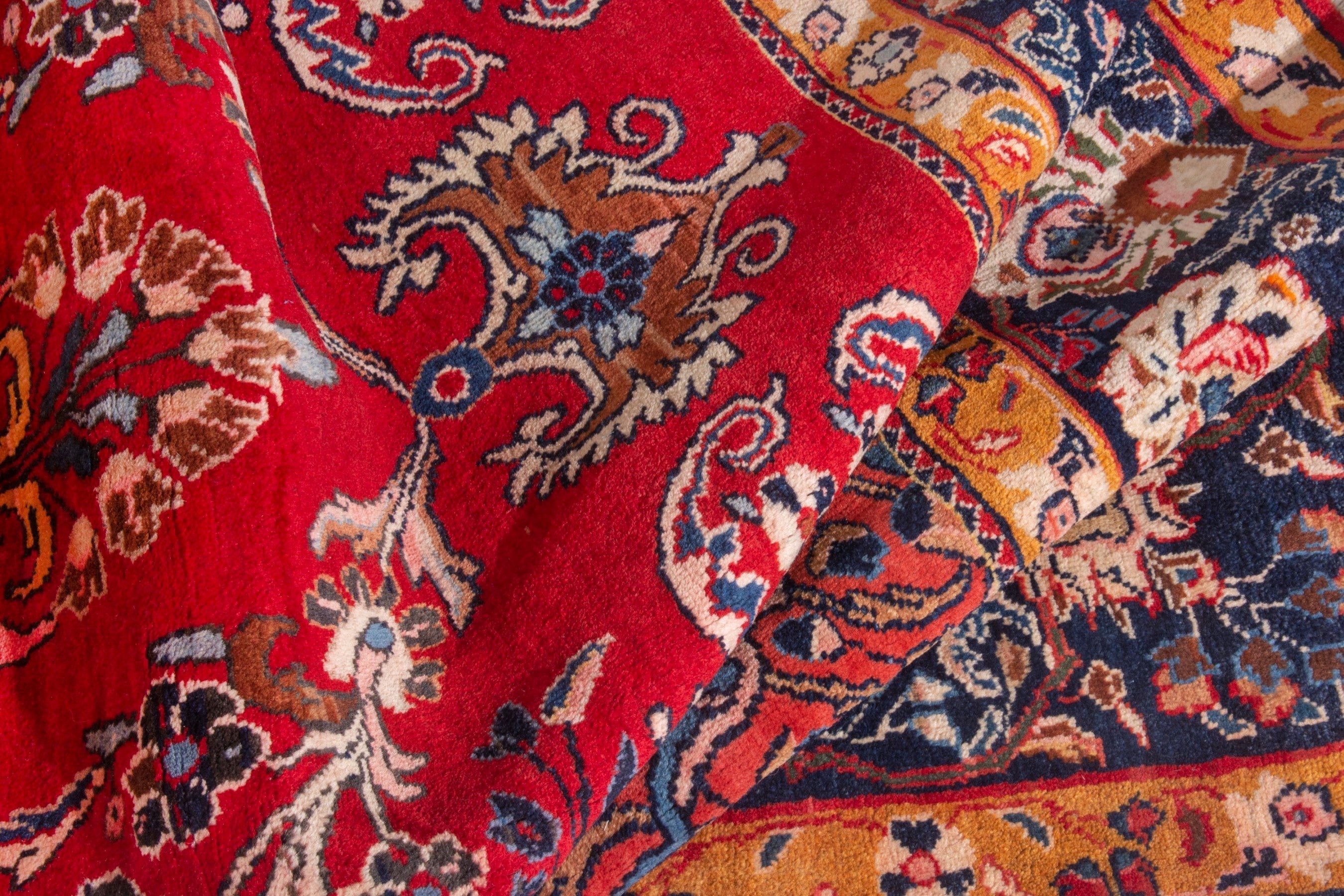 Persian Arak oversized rug in deep red and navy, view 18 of 21