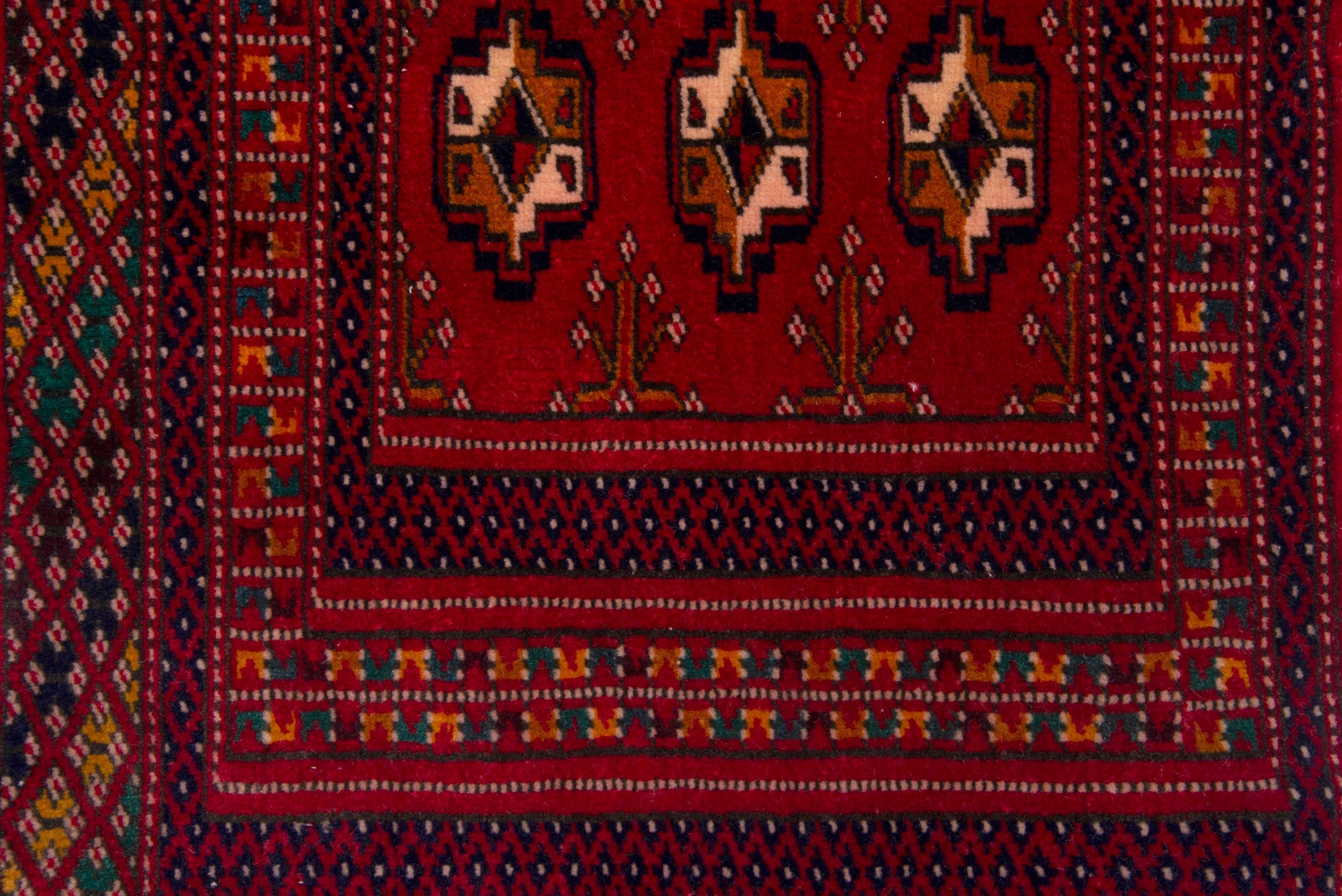 Persian Torkaman accent rug in deep red and gold, view 6 of 7