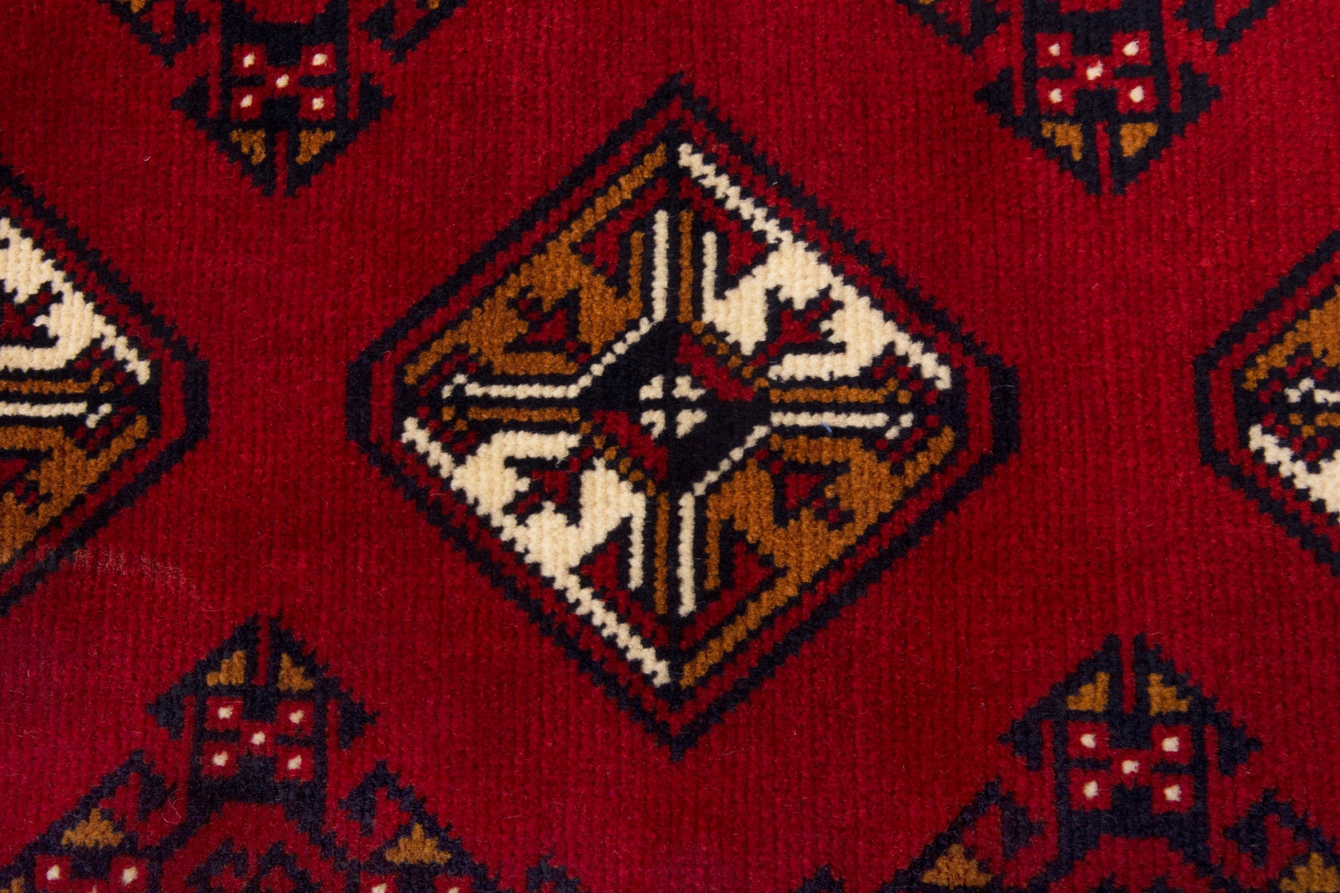 Persian Torkaman accent rug in deep red and burgundy, view 6 of 7